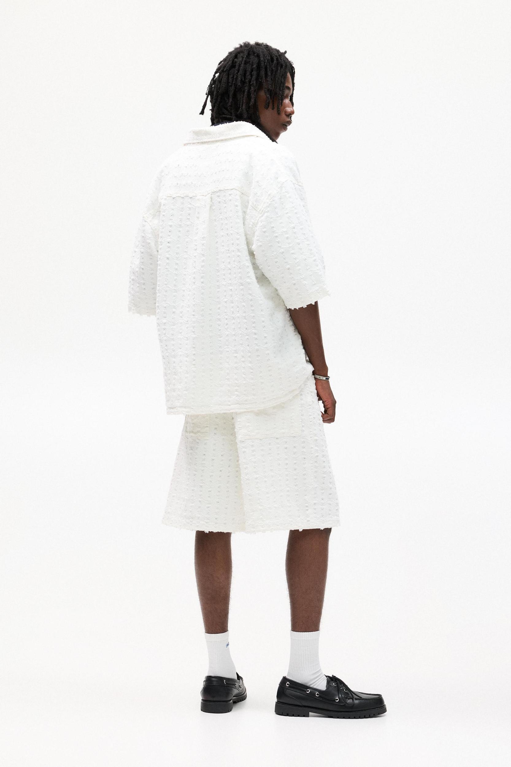 Textured baggy denim Bermuda shorts Product Image