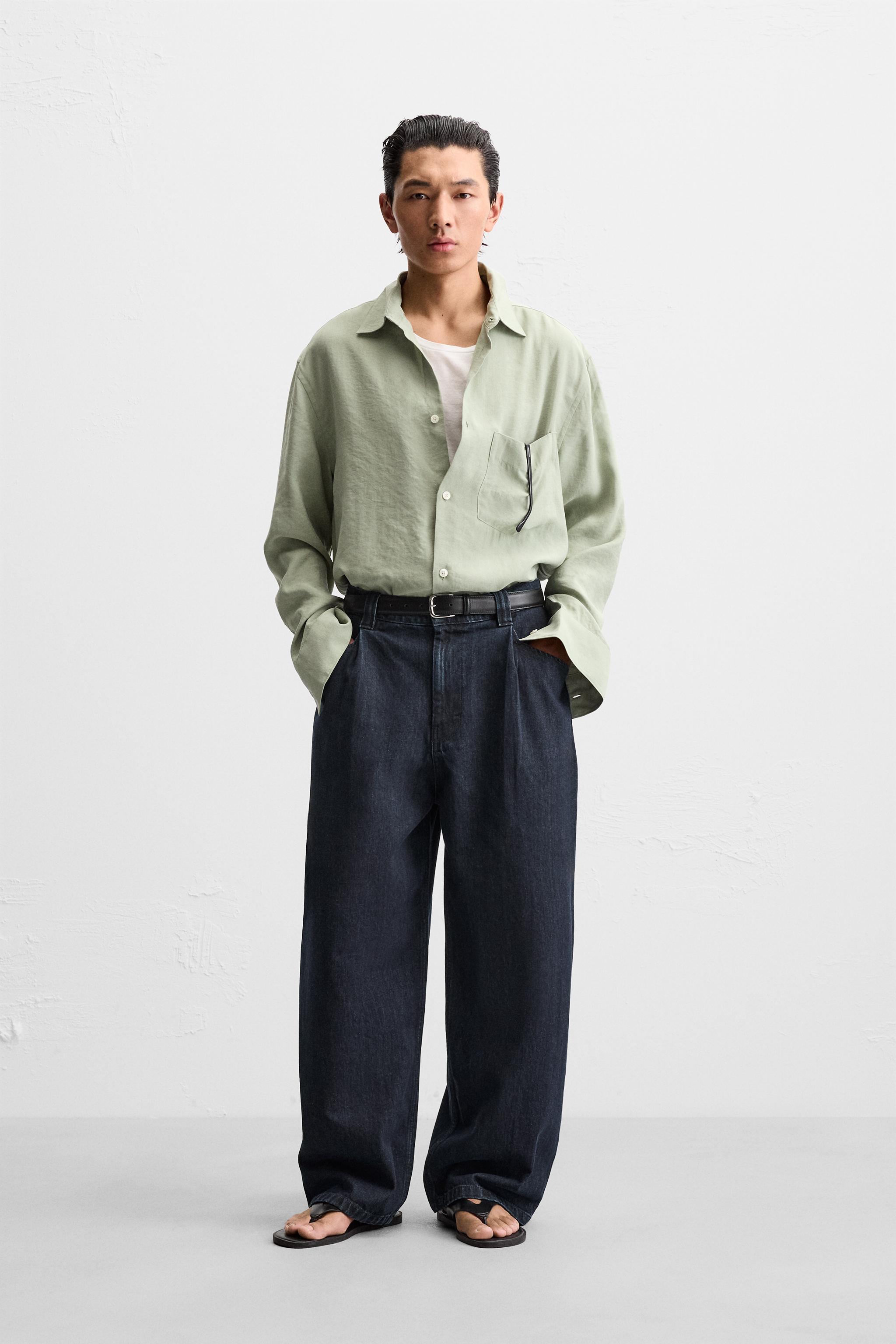 PLEATED WIDE LEG JEANS Product Image