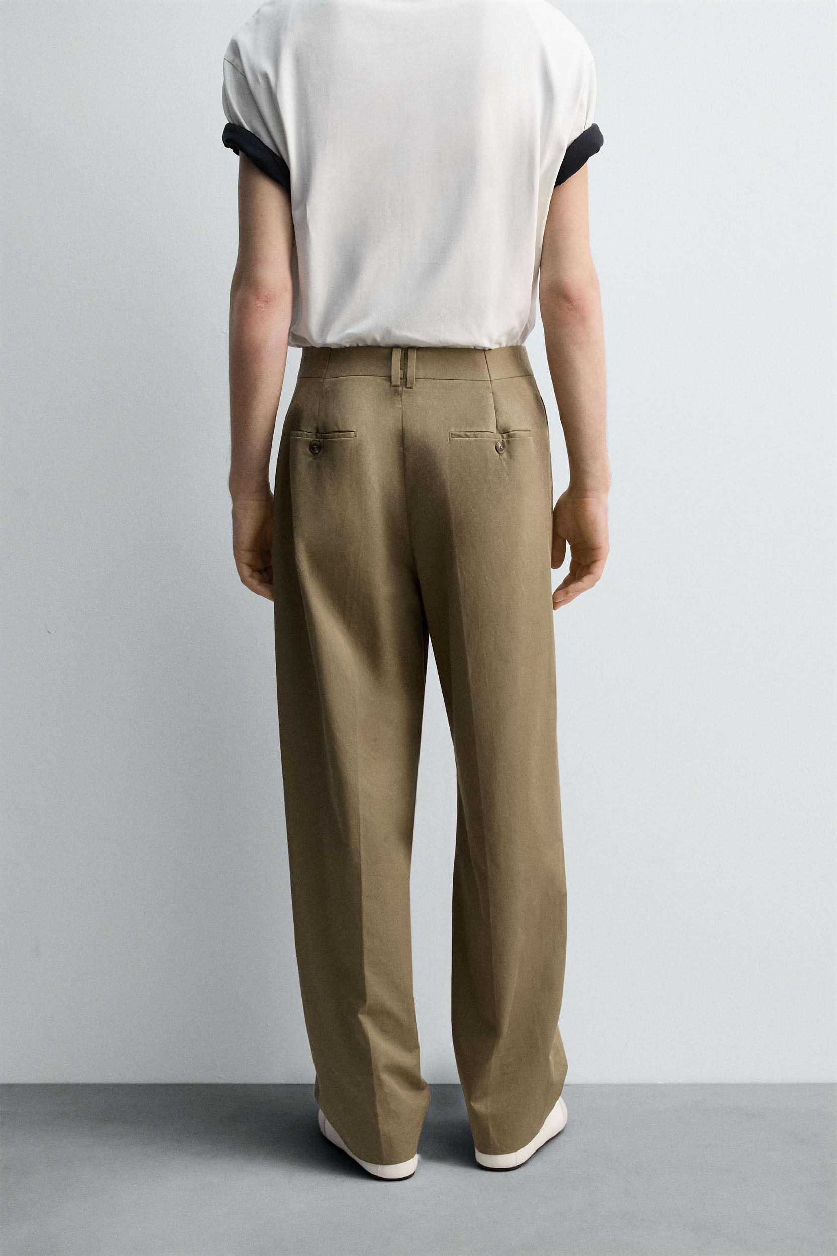 LIMITED EDITION RELAXED FIT PLEATED PANTS Product Image