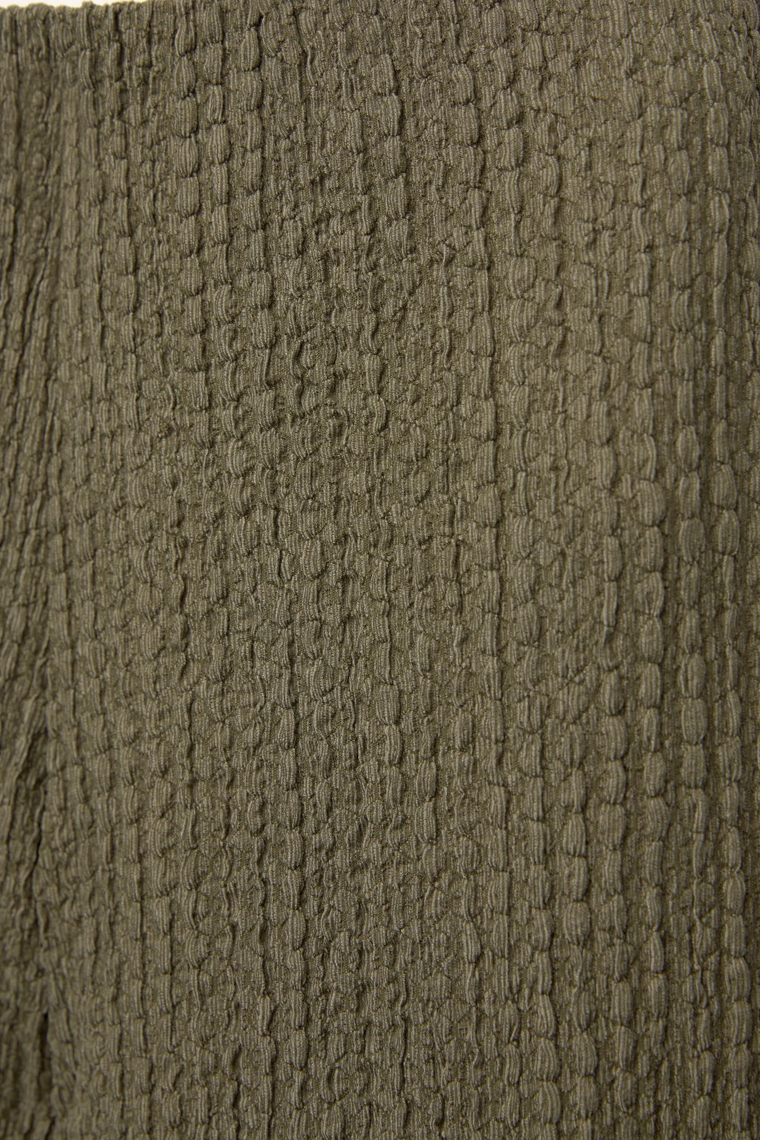 Creased-effect pants Product Image