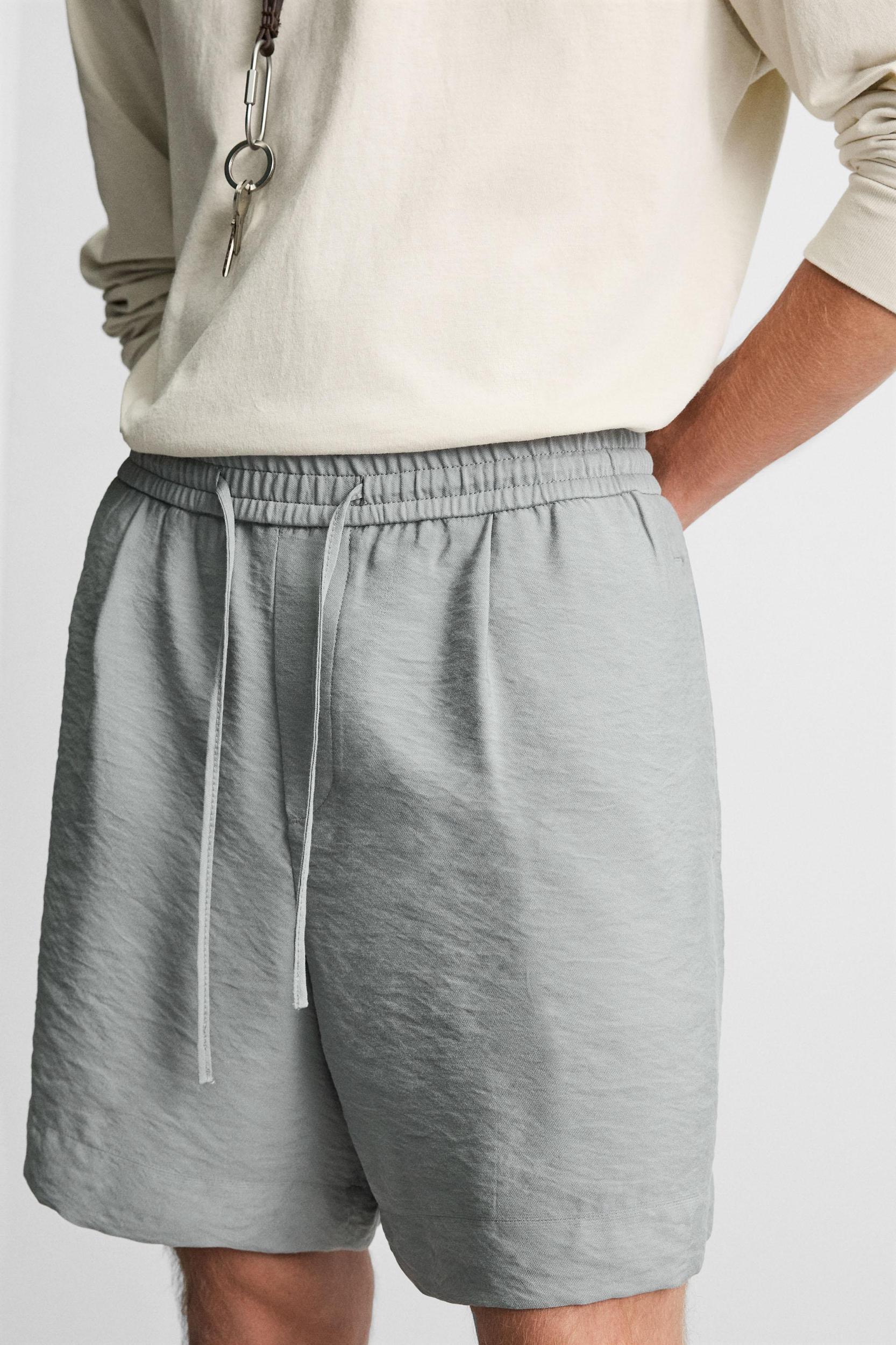 FLOWY RELAXED FIT BERMUDA SHORTS Product Image