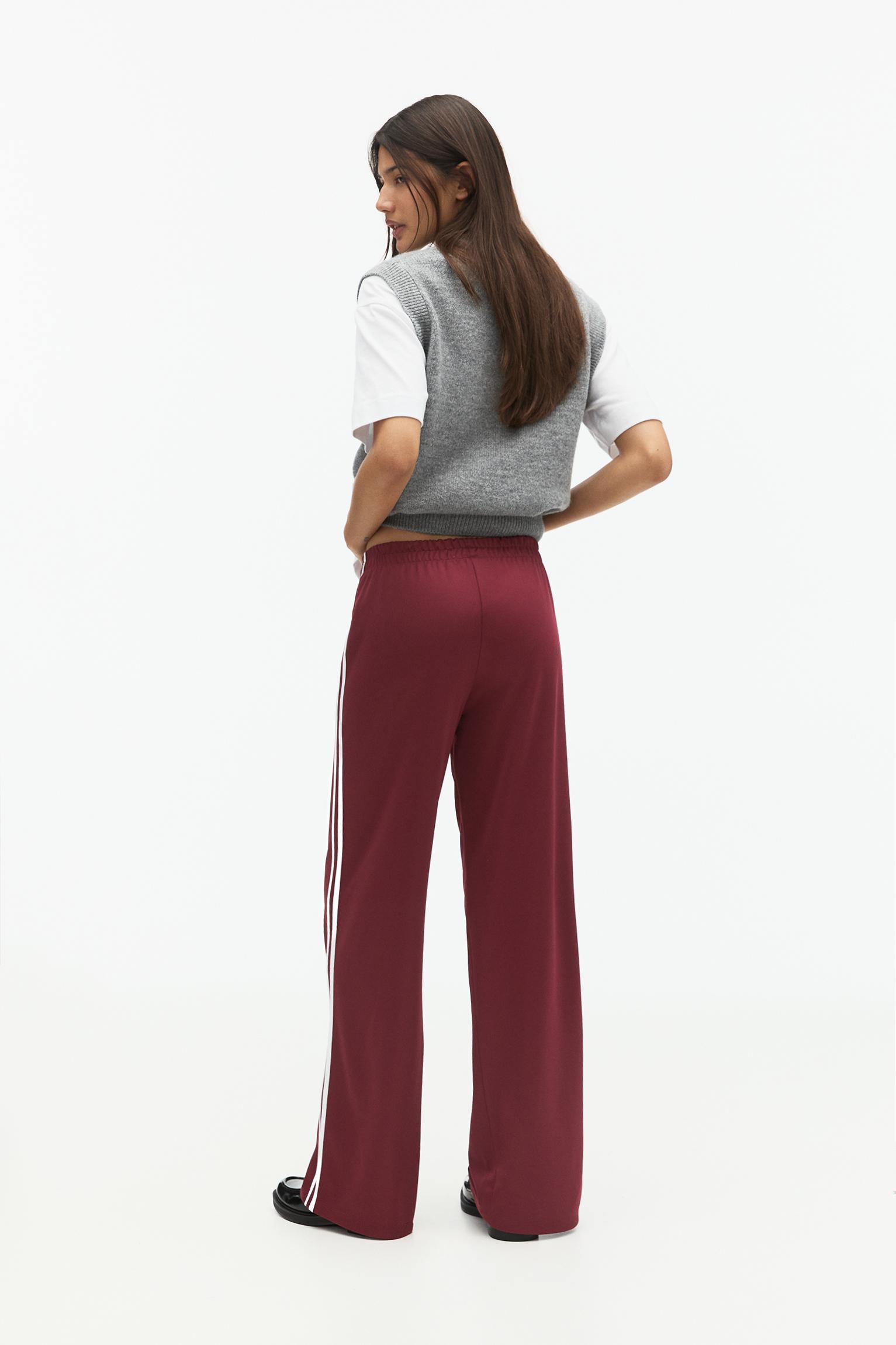Tracksuit pants with side stripes Product Image