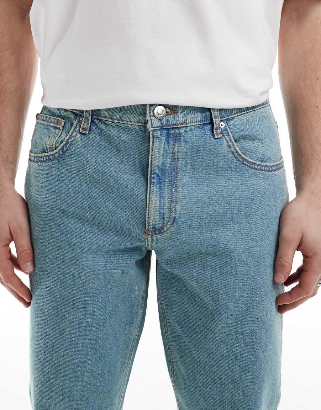 ASOS DESIGN tapered jeans in tinted light wash blue  Product Image