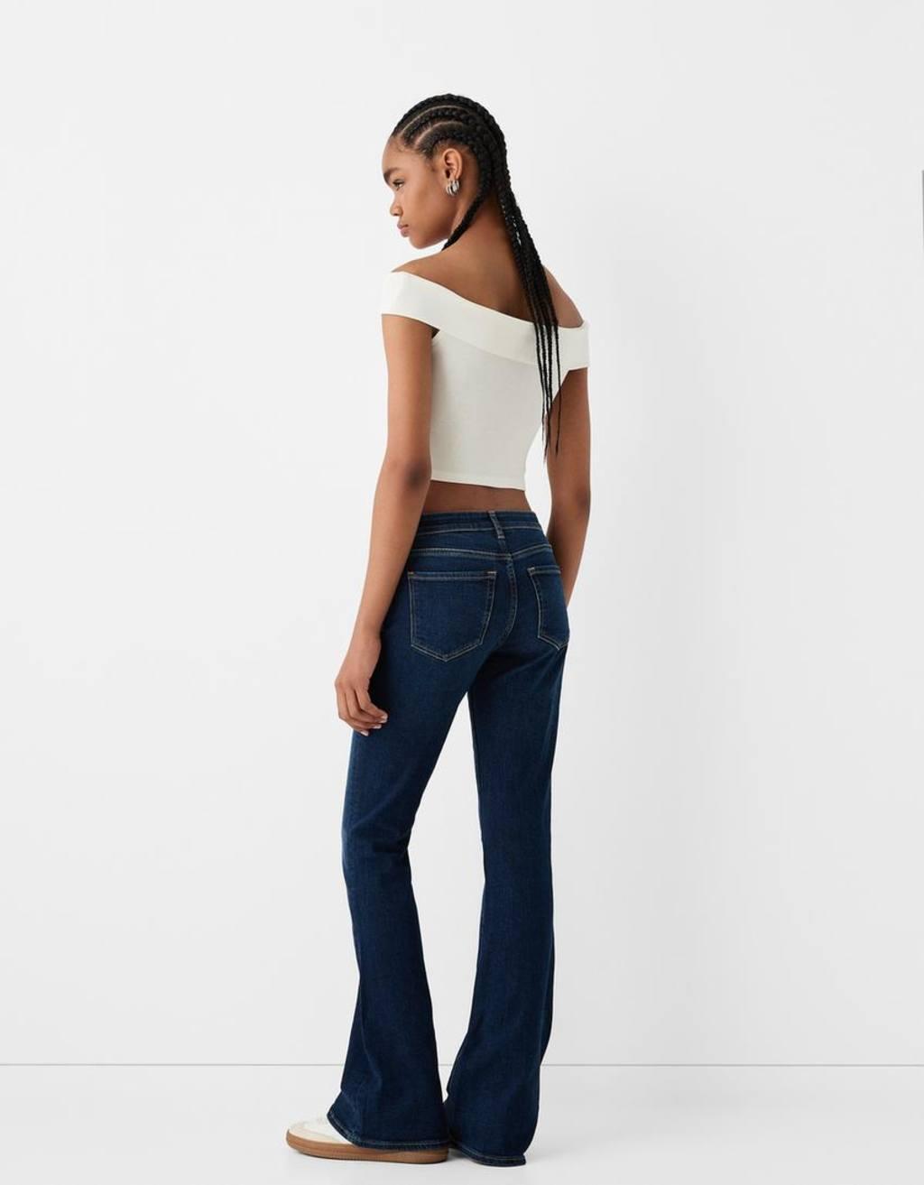 Bershka high rise flared jeans in dark wash Product Image