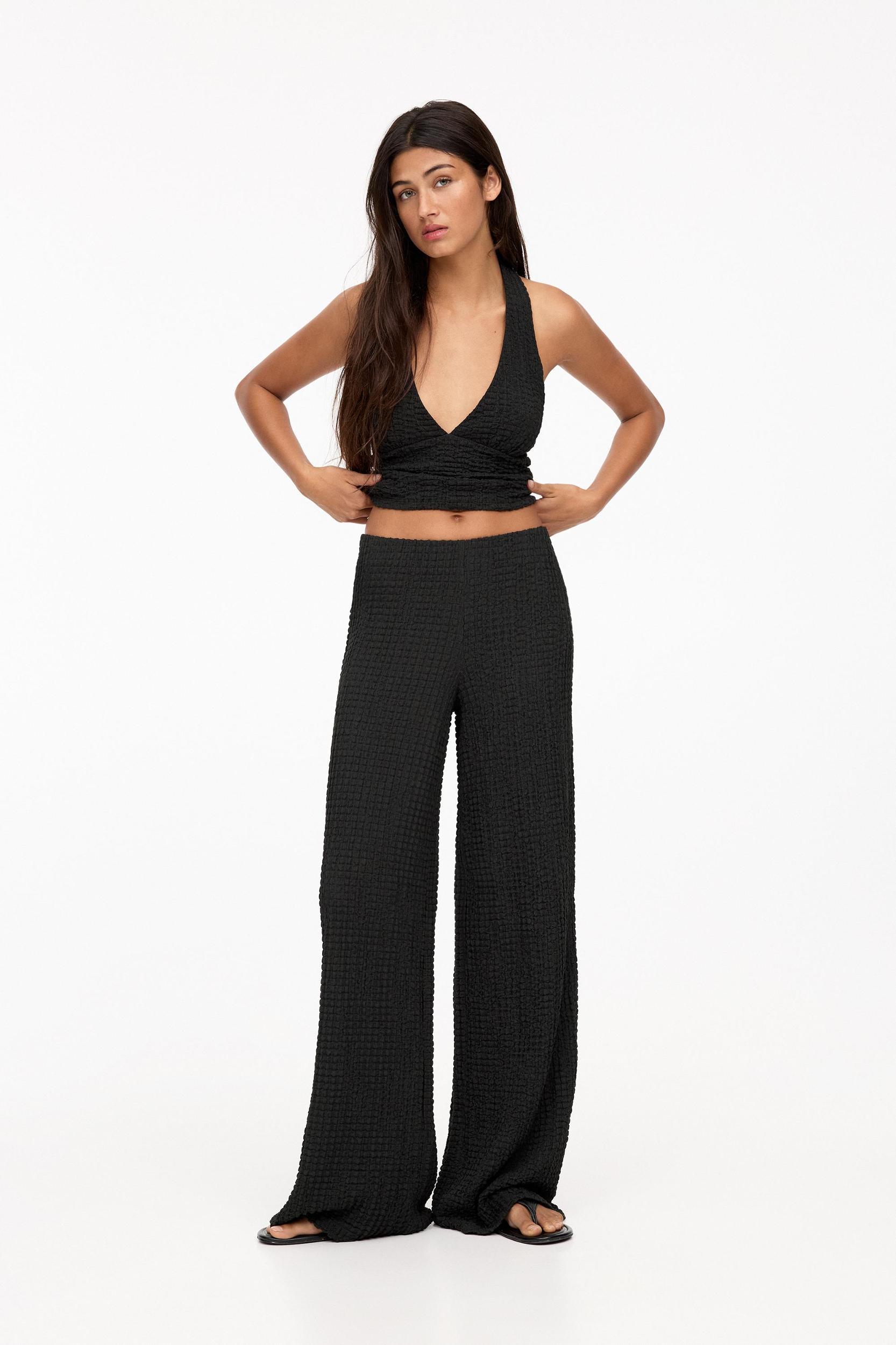 Rustic creased-effect pants Product Image