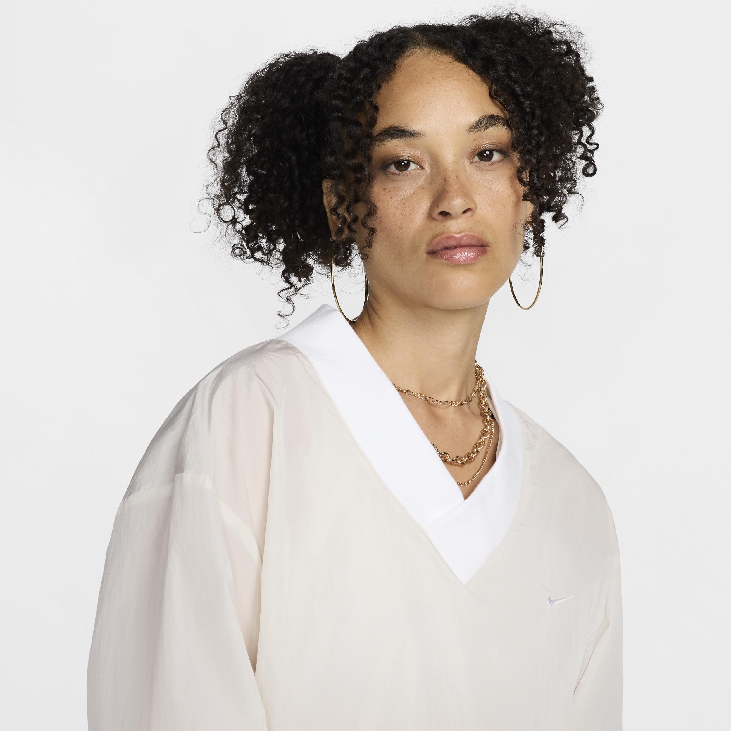 Women's Nike Sportswear Essential Loose UV Woven Long-Sleeve V-Neck Top Product Image