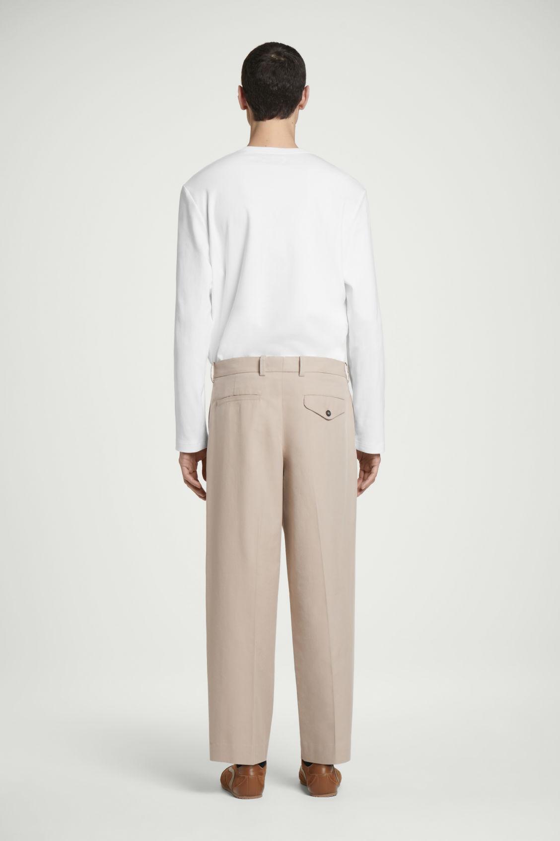 RELAXED PLEATED COTTON TAPERED PANTS Product Image