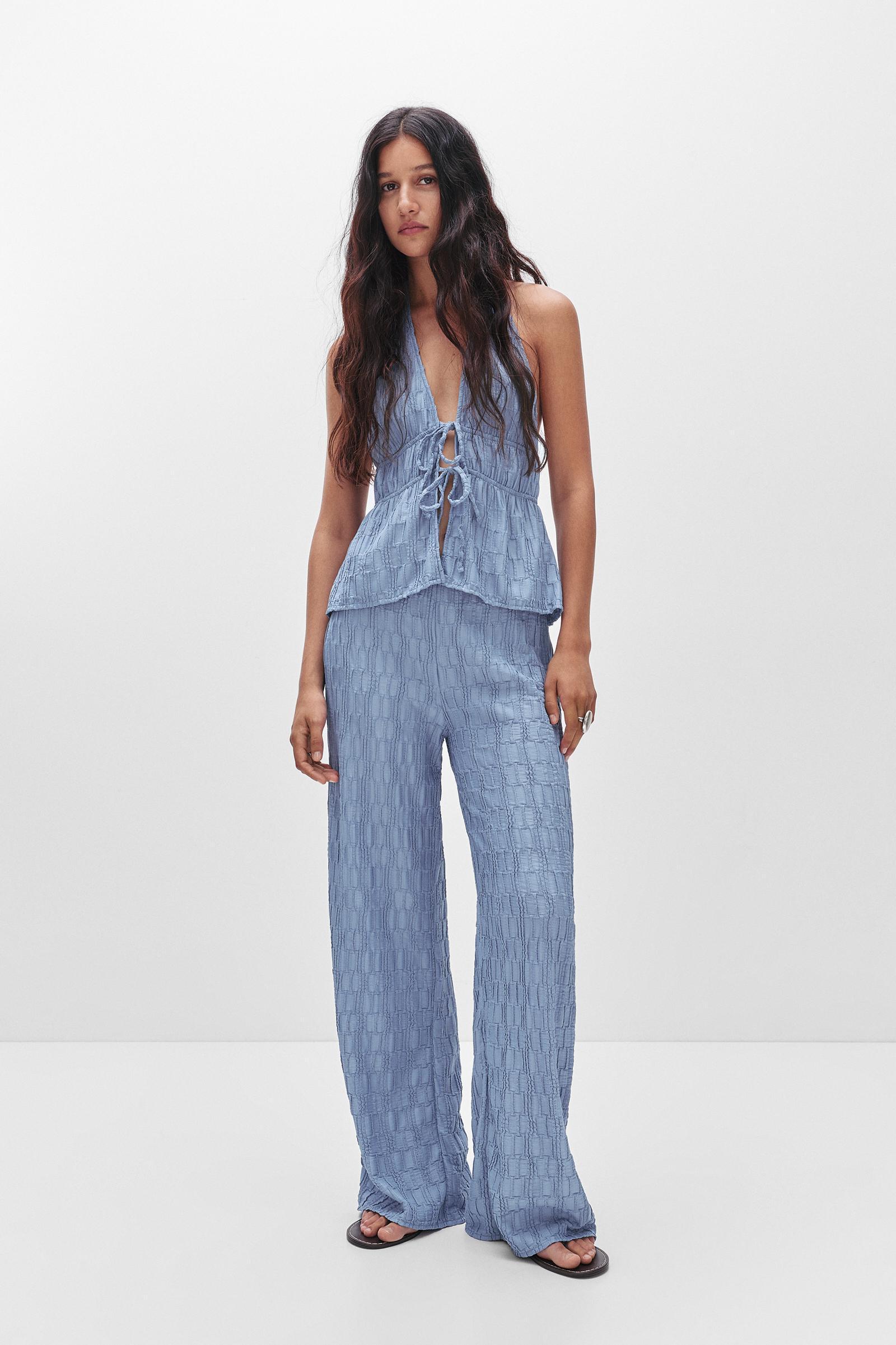 Textured bell bottom trousers Product Image