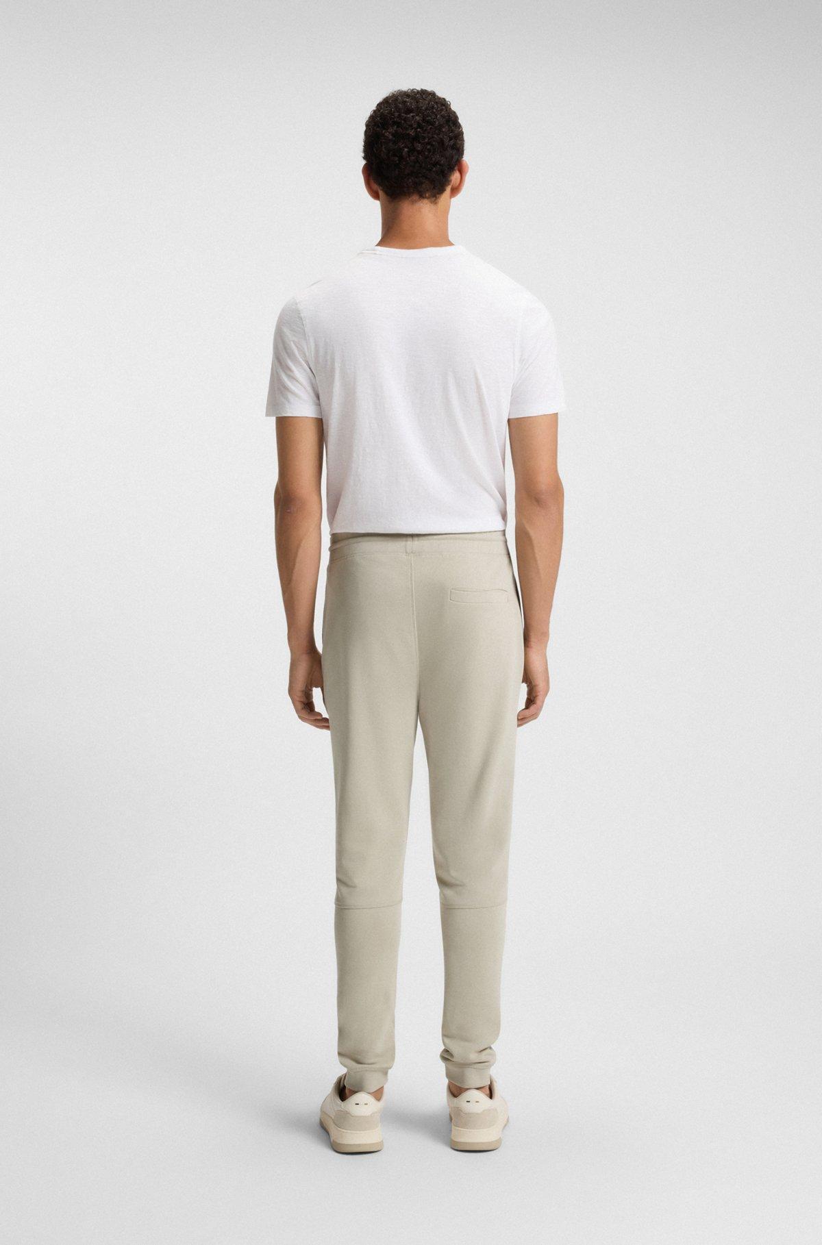 Cotton-terry tracksuit bottoms with logo patch Product Image