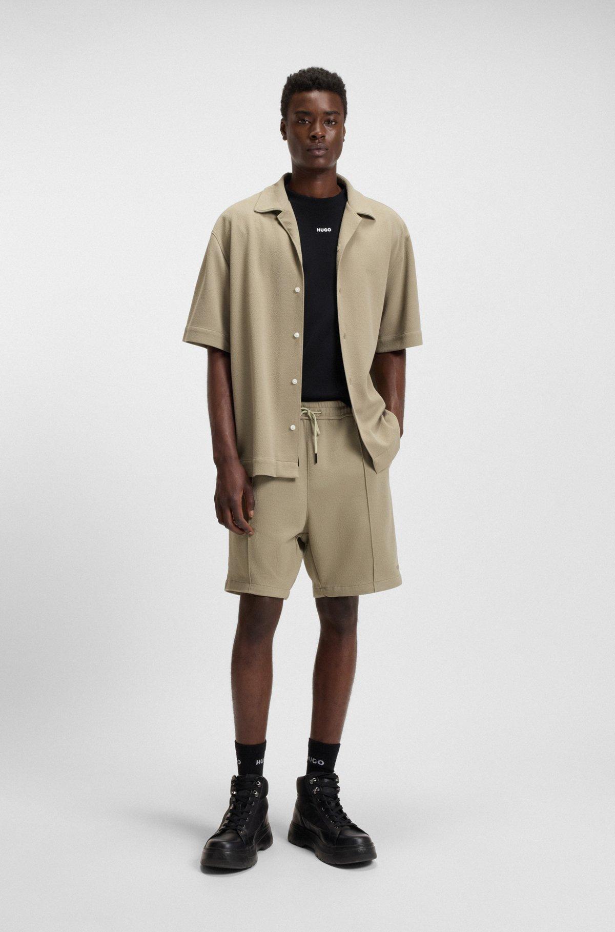 HUGO - Relaxed-fit T-shirt in cotton with logo print - Black Product Image