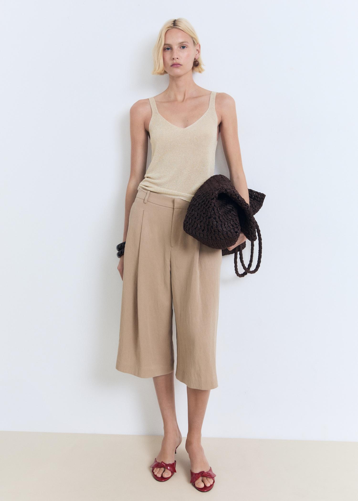 Lurex knitted V-neck top - Women | MANGO USA Product Image