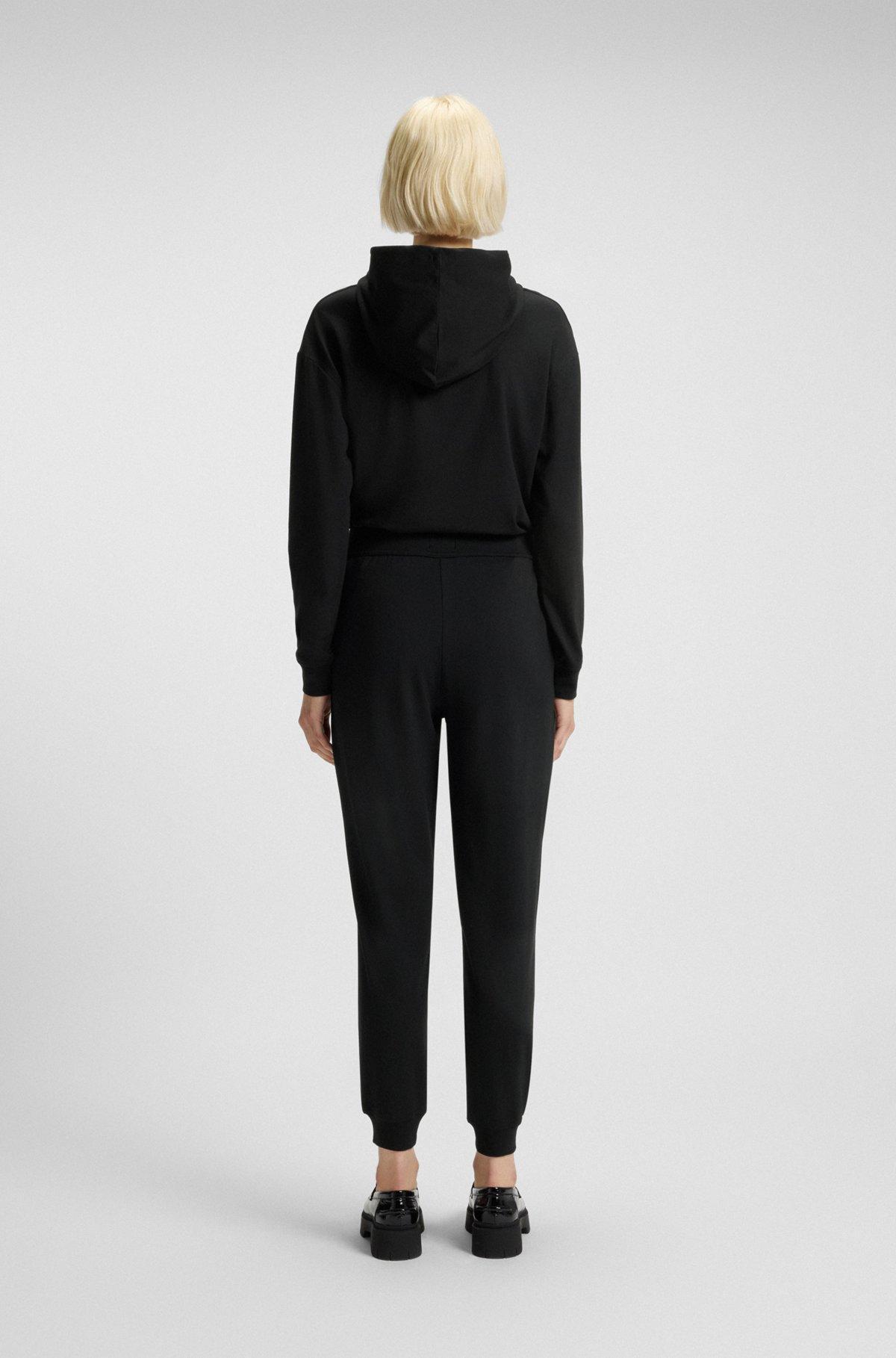 Relaxed-fit tracksuit bottoms with printed logo Product Image