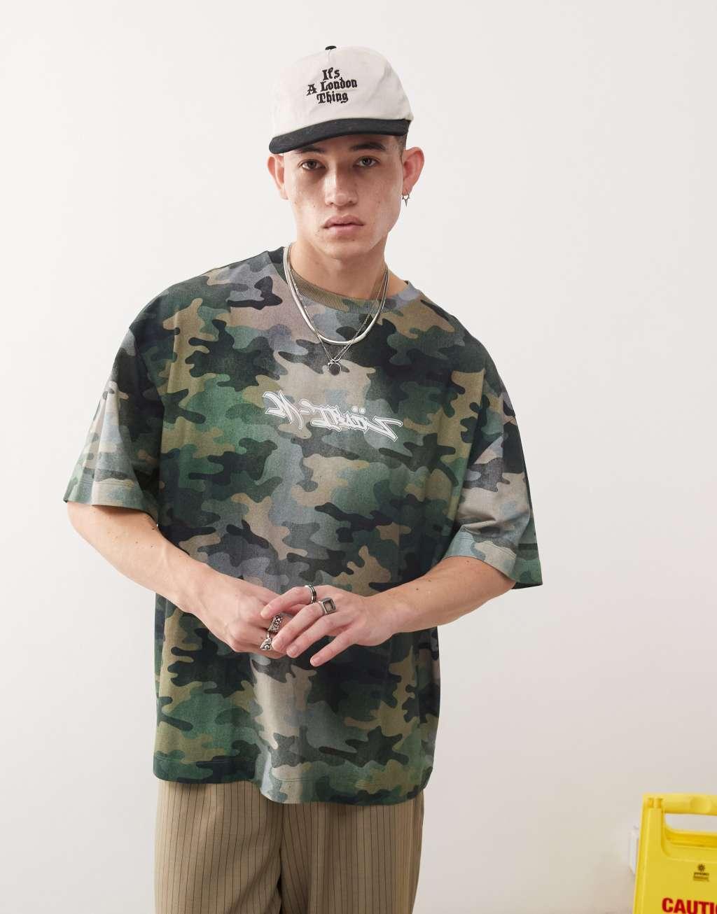 COLLUSION relaxed graffiti graphic t-shirt in camo print Product Image