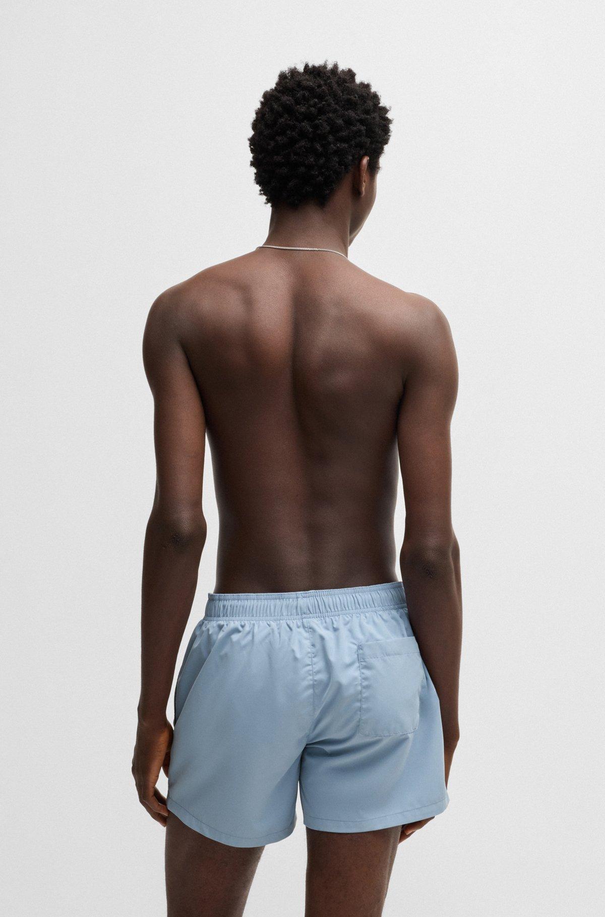 HUGO - Quick-dry swim shorts with vertical logo print - Light Blue Product Image