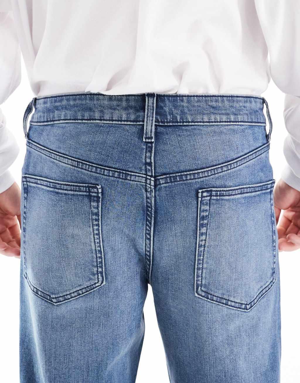 ASOS DESIGN slim jeans with tint in mid wash blue Product Image