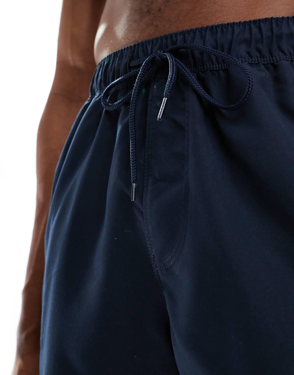 ASOS DESIGN swim shorts in short length in navy Product Image