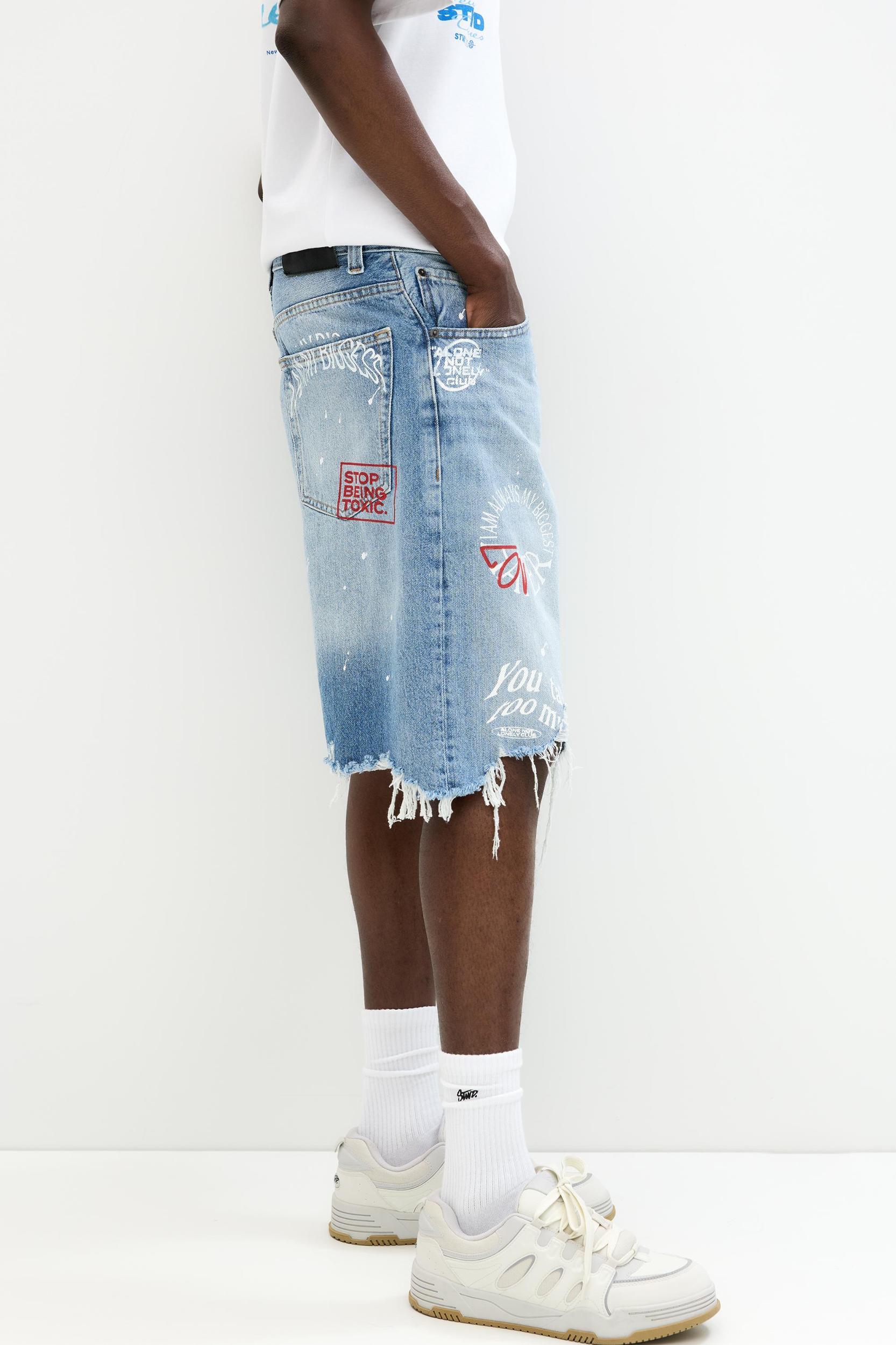 Ripped denim Bermuda shorts Product Image
