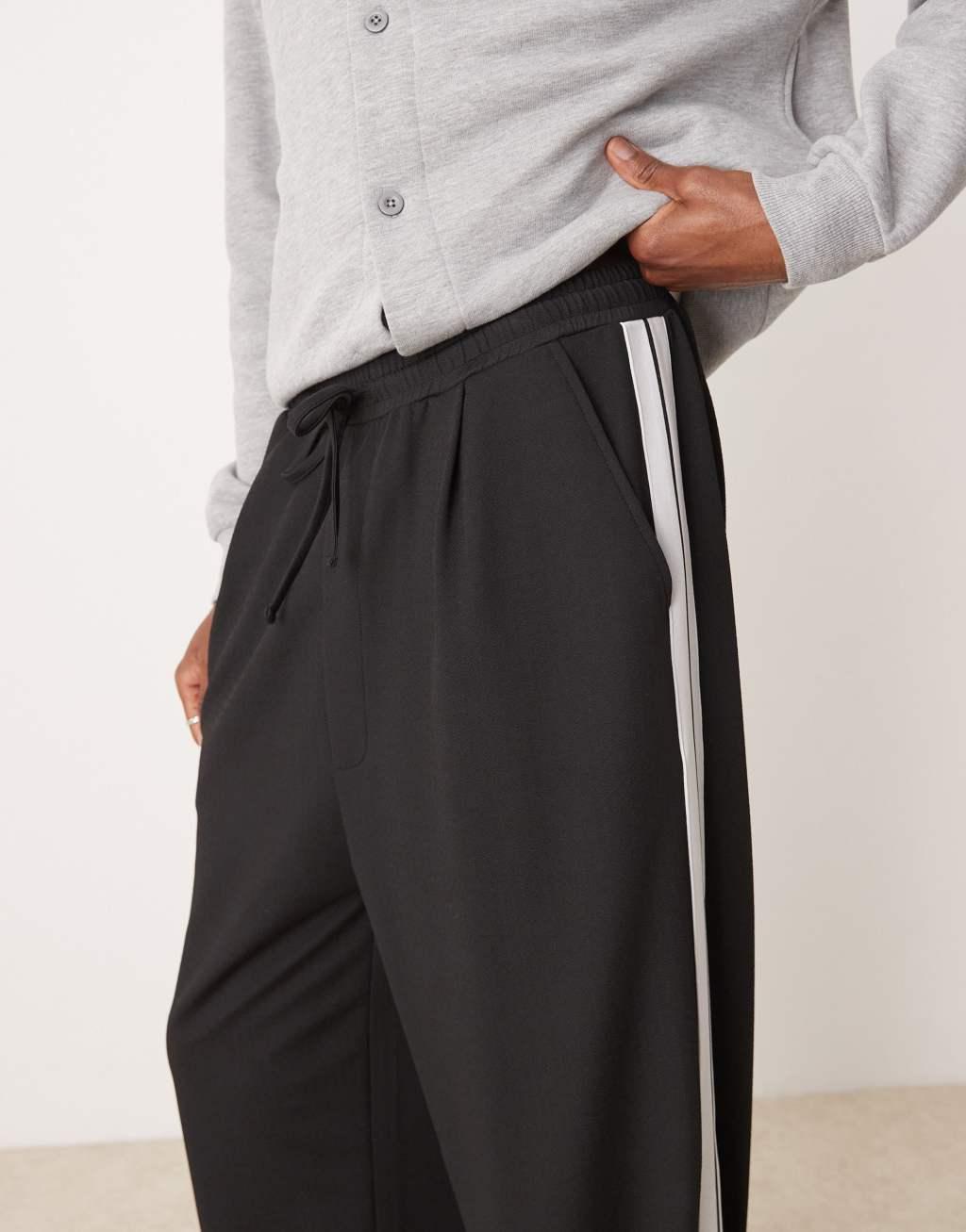 ASOS DESIGN super baggy smart sweatpants with taping in black Product Image