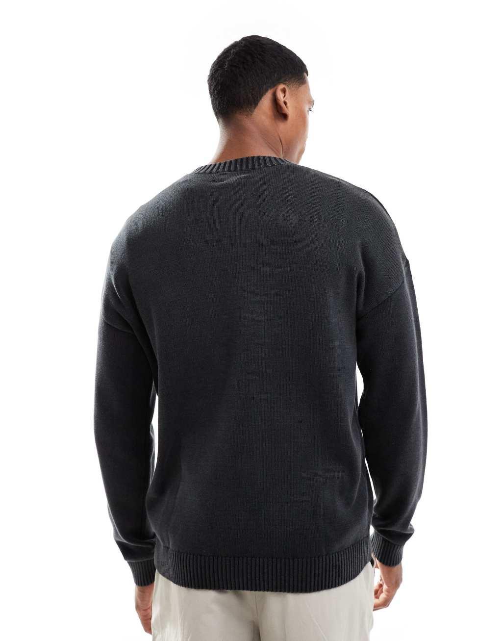 ASOS DESIGN washed relaxed knit crew neck sweater in black  Product Image