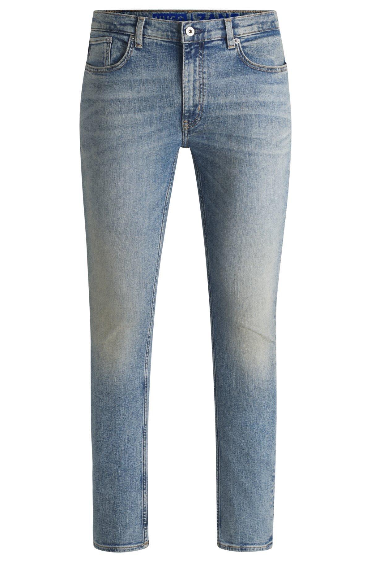 Extra-slim-fit jeans in stonewashed blue stretch denim Product Image