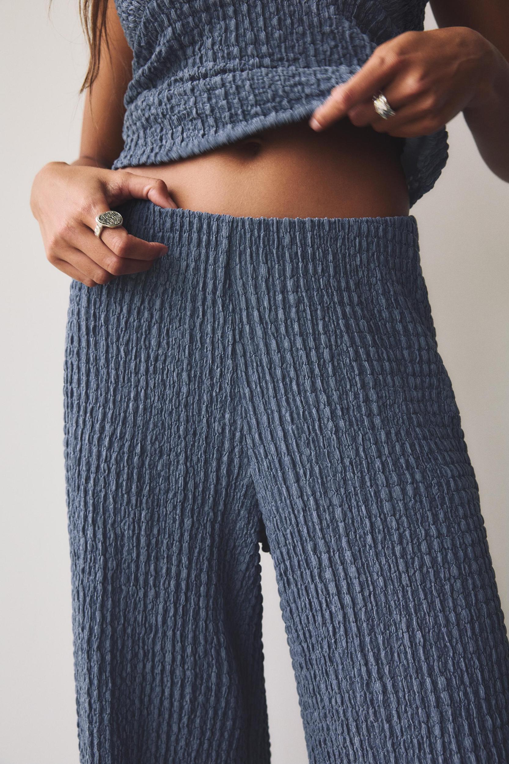 Rustic creased-effect pants Product Image