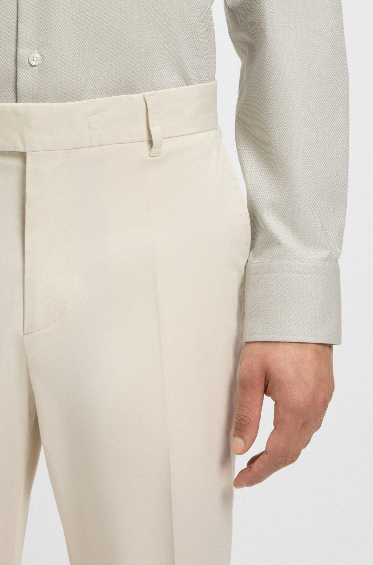 Machine-washable tapered-fit trousers in stretch fabric Product Image