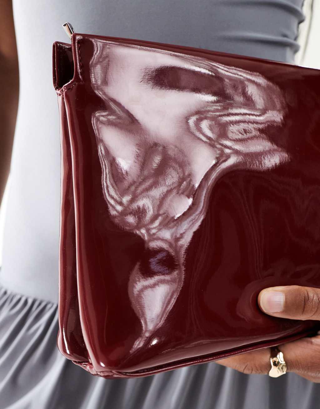 ASOS DESIGN zip top clutch in burgundy Product Image