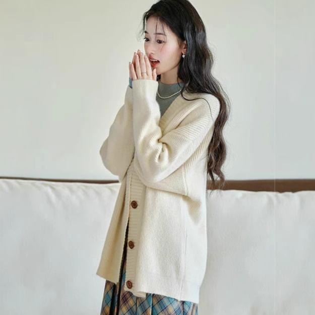 Long-Sleeve Mock Neck Plain Knit Top / V-Neck Cardigan / High Waist Plaid Pleated Midi A-Line Skirt / Set Product Image