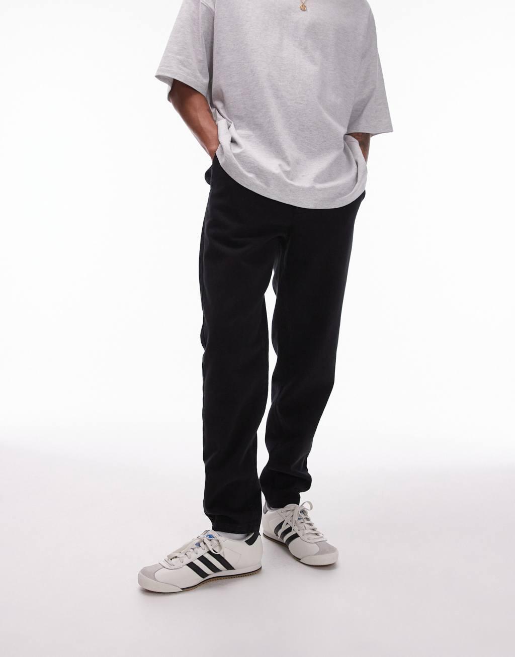 Topman tapered pants with elasticated waistband in black Product Image