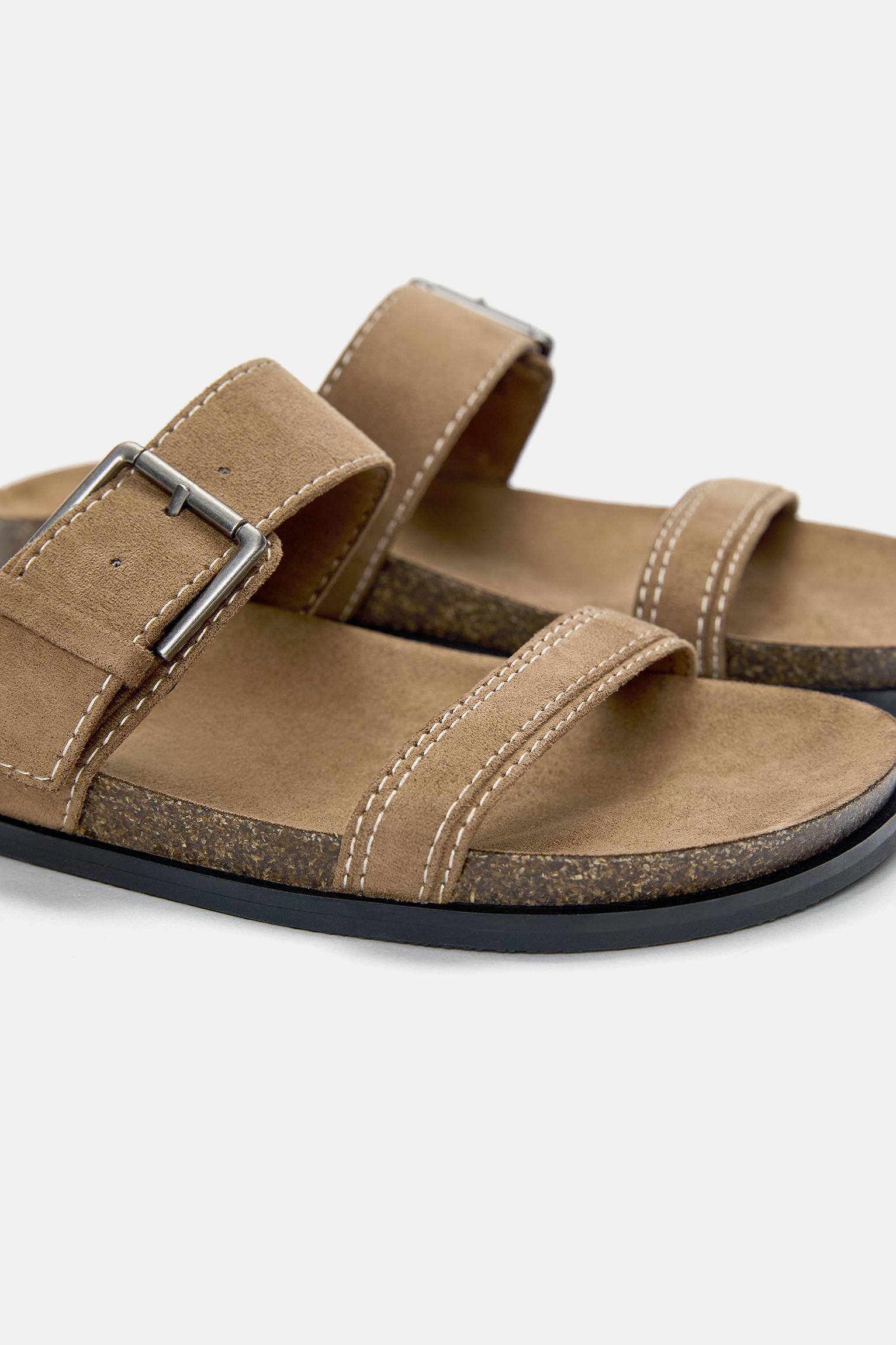 Flat sandals with buckles Product Image