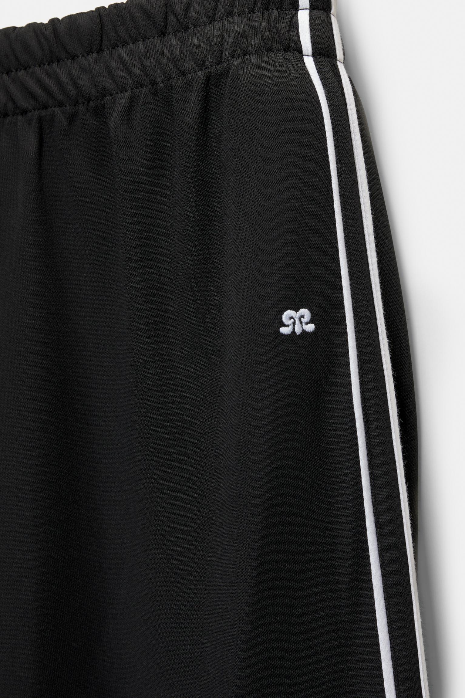Tracksuit pants with side stripes Product Image