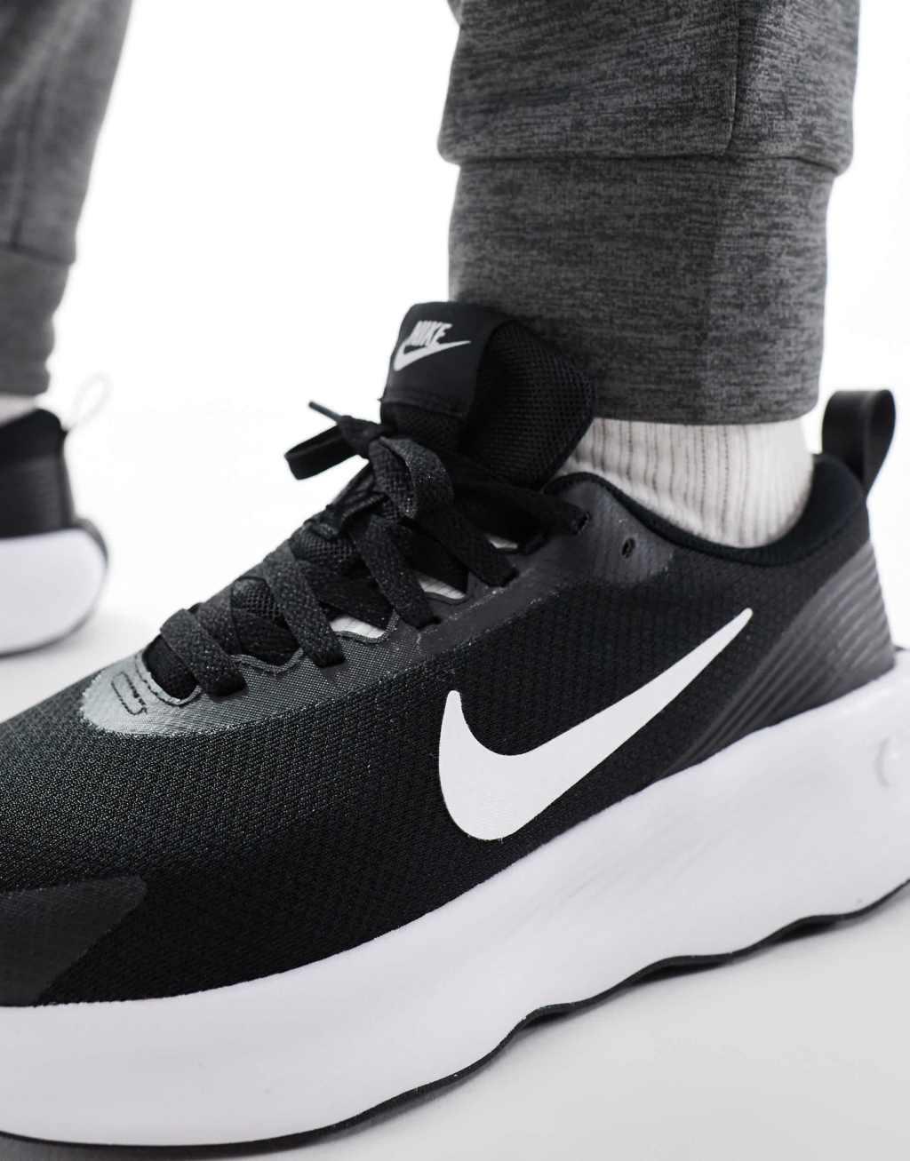 Nike Training Legend Essential 4 sneakers in black and white Product Image