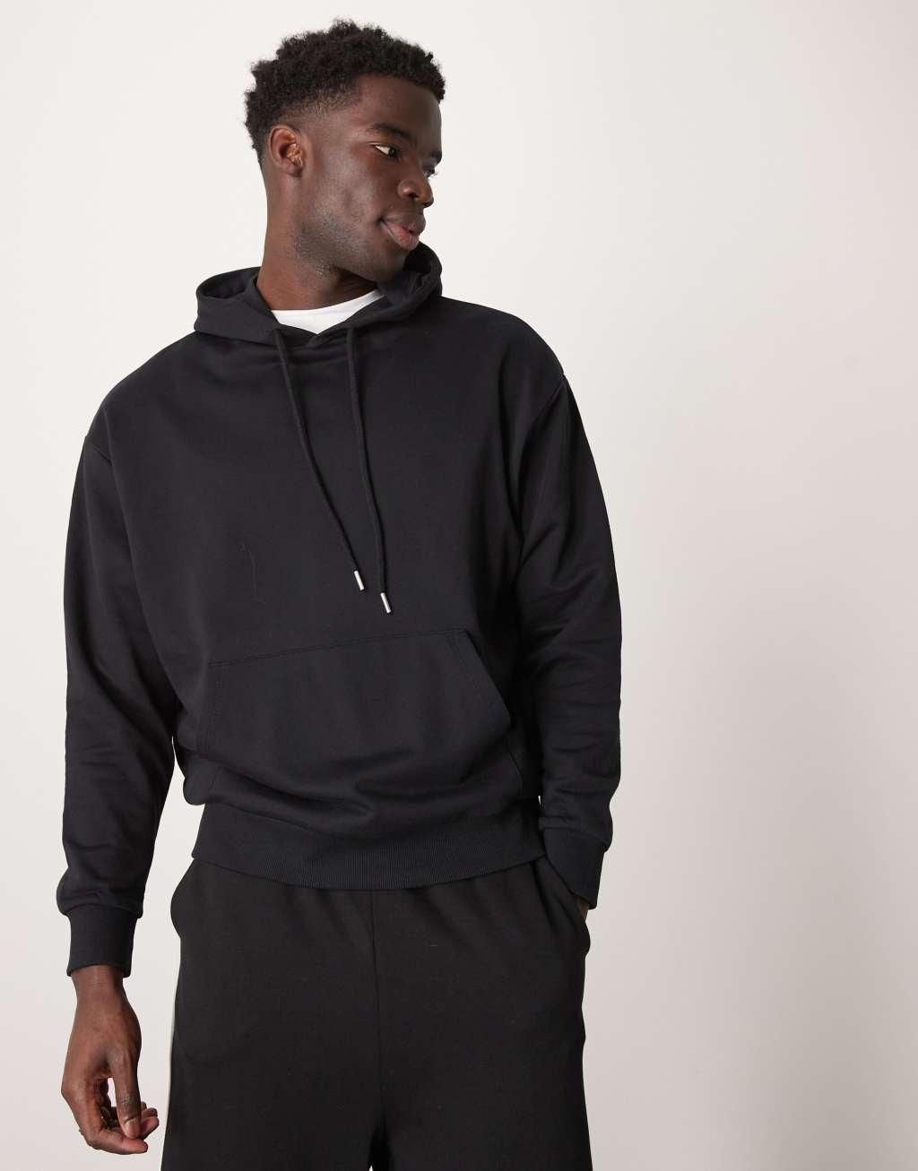 ASOS DESIGN oversized hoodie with photographic back print in black Product Image