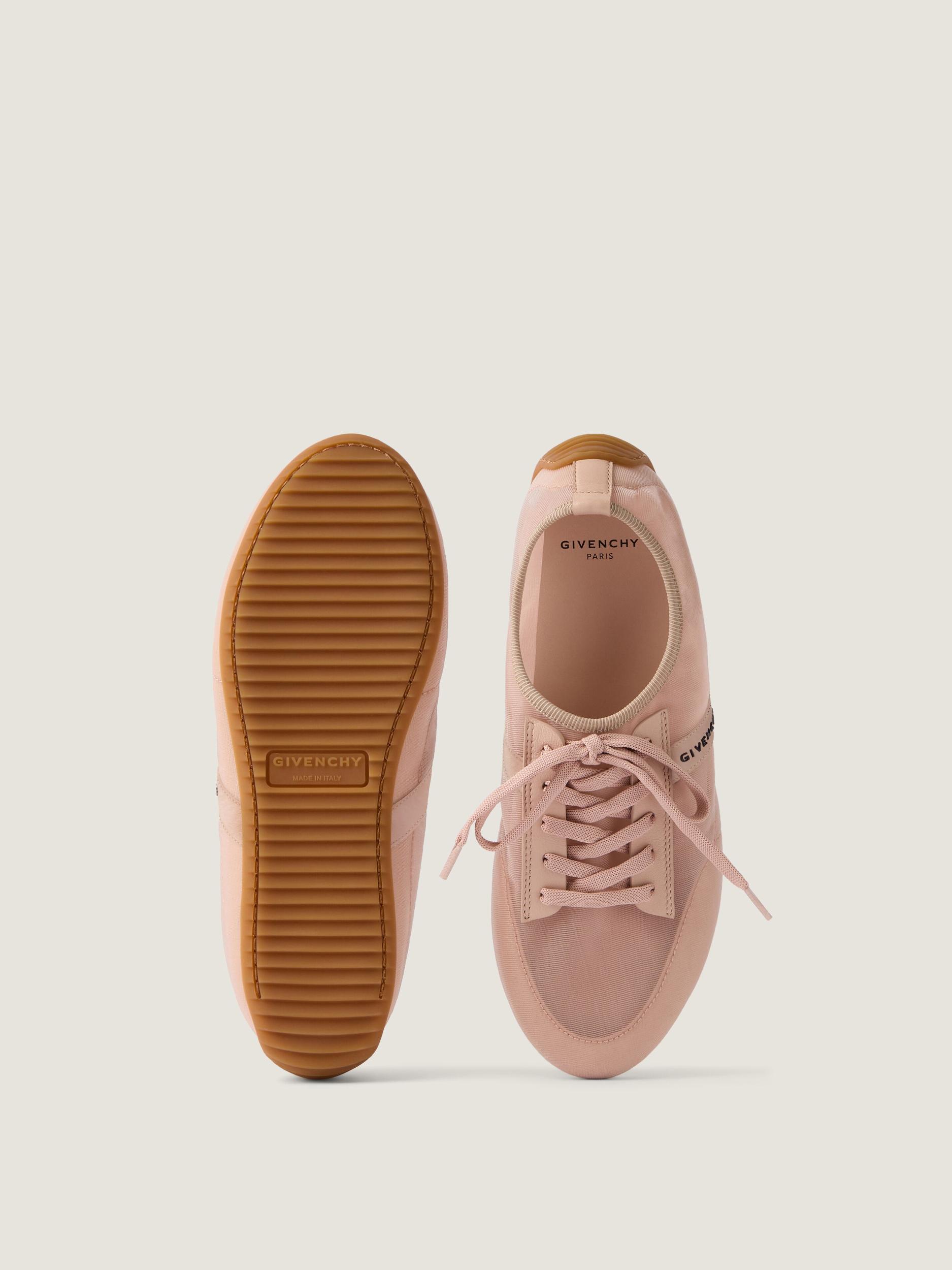 Slim sneakers in transparent mesh and leather Product Image