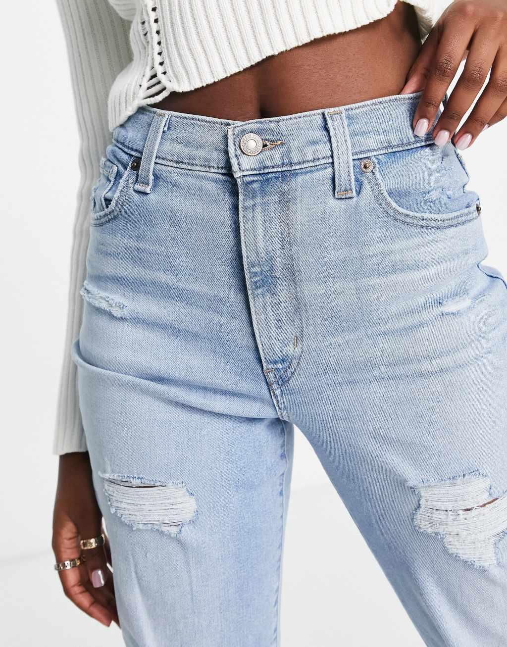 Levi's high waisted distressed mom jean in light wash blue Product Image