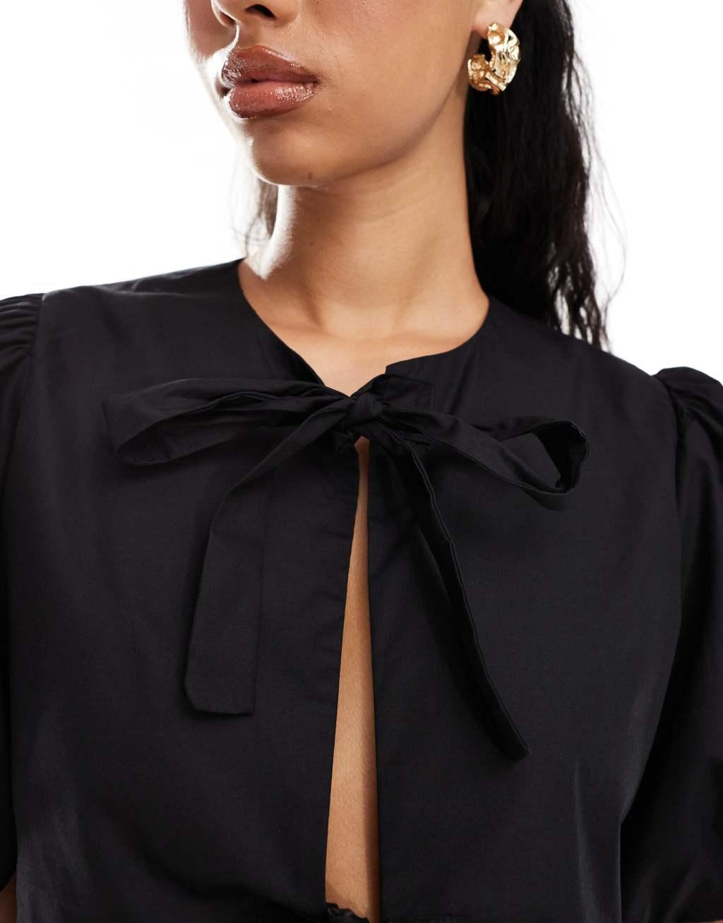 Kaiia puff sleeve tie front top in black Product Image