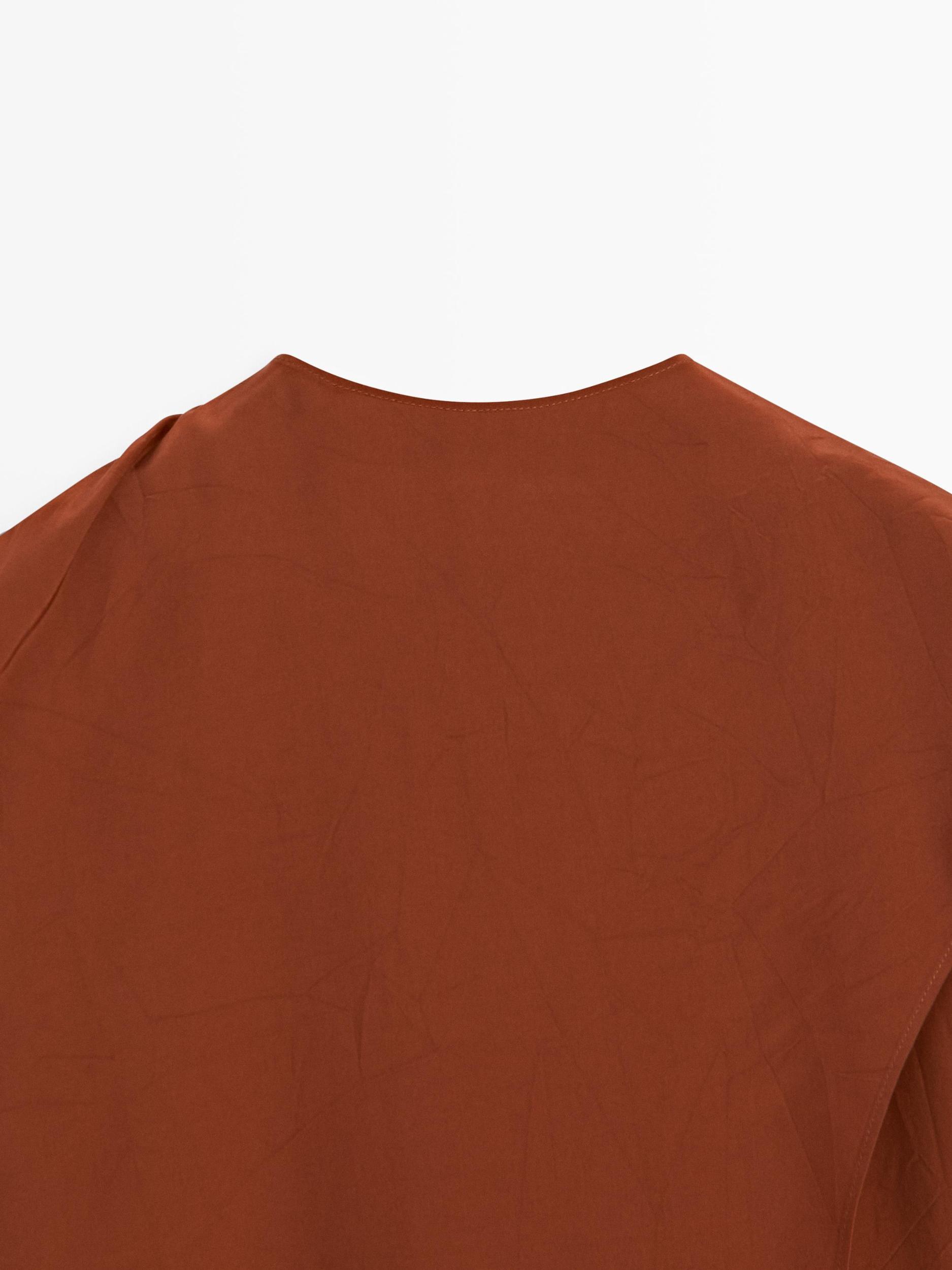 Flowing blouse with tied neck Product Image