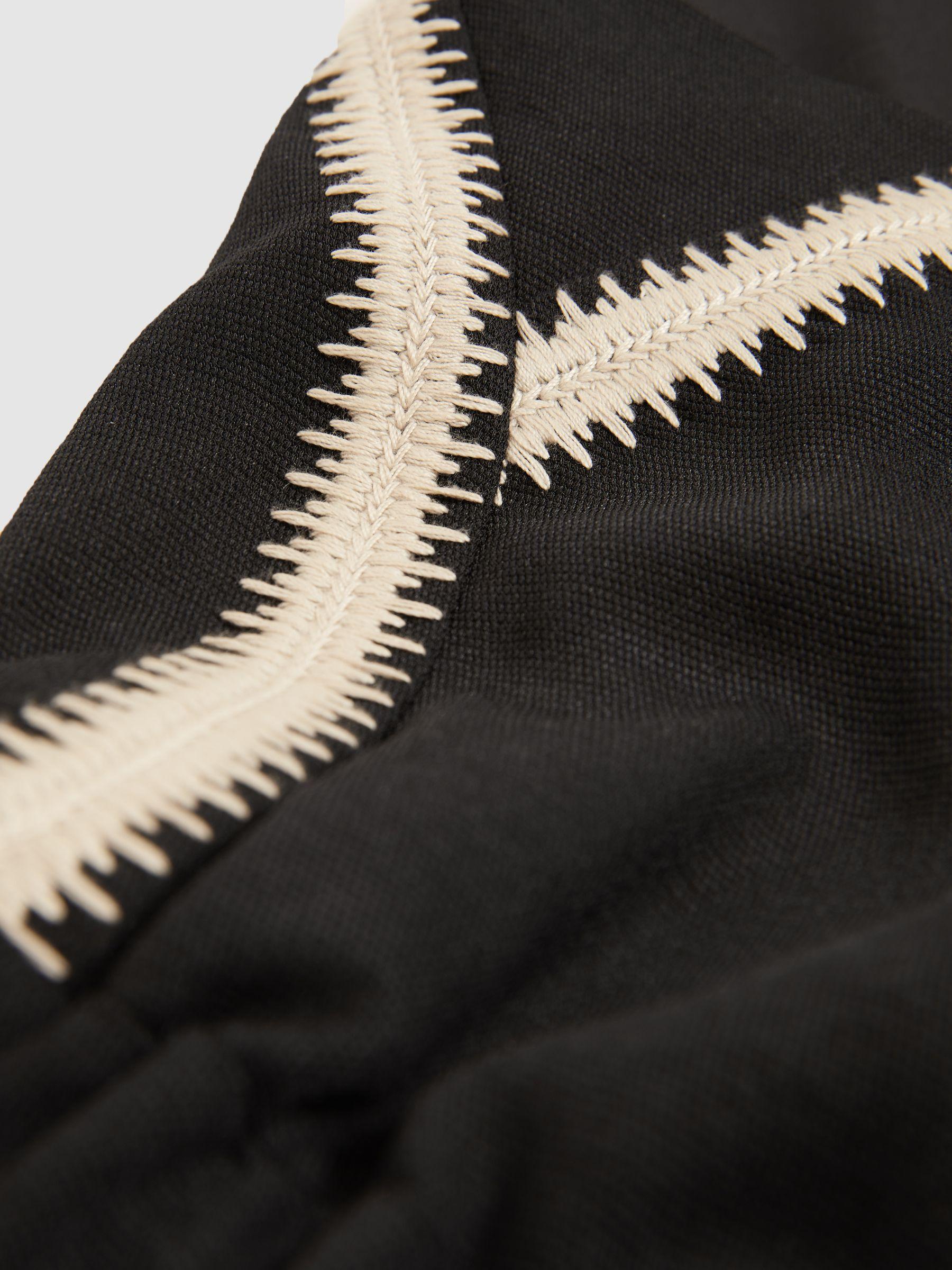 Petite Halterneck Craft Stitch Jumpsuit in Black Product Image