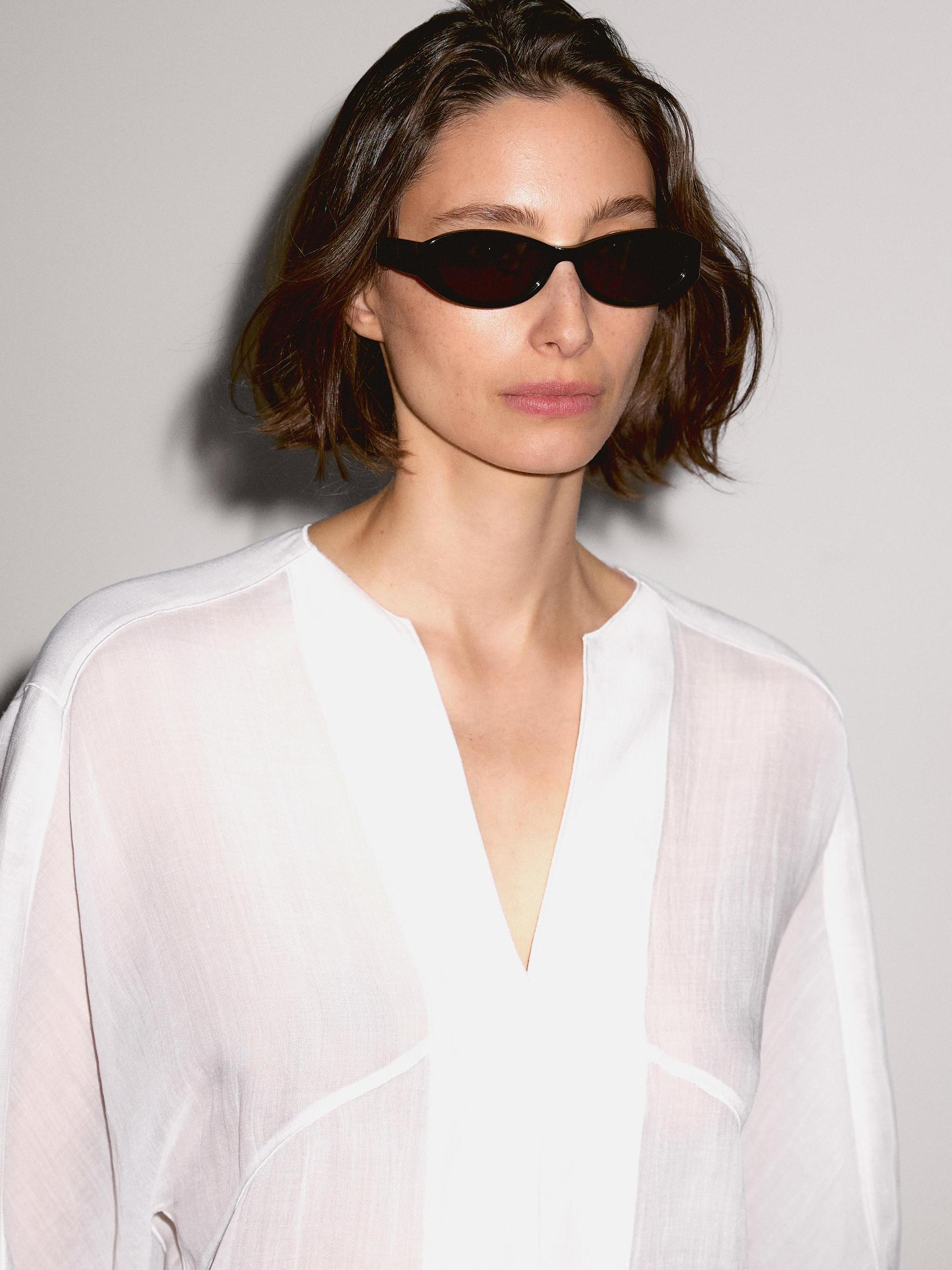 Flowing linen blend blouse with seam details Product Image