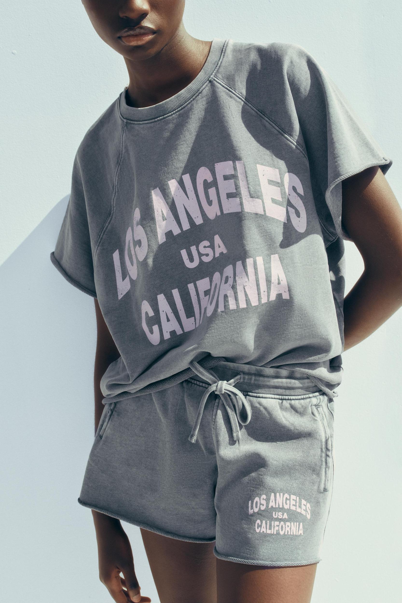 WASHED EFFECT TEXT PLUSH SWEATSHIRT Product Image