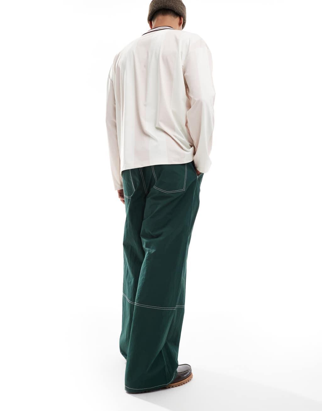 ASOS DESIGN baggy pants in green nylon with contrast stitch Product Image