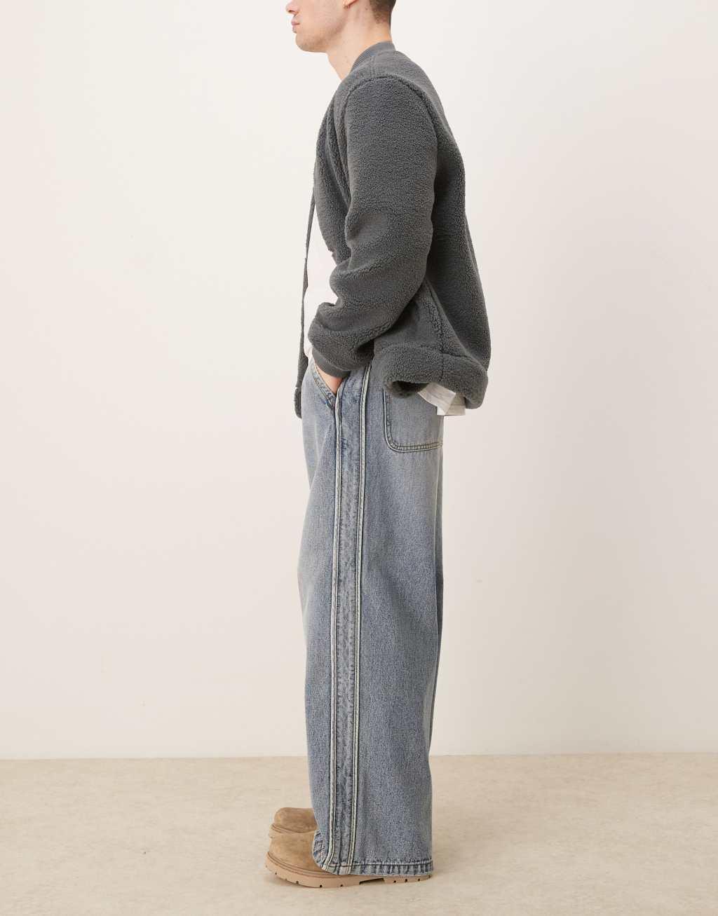 ASOS DESIGN super baggy jeans with elastic waist in mid wash blue Product Image