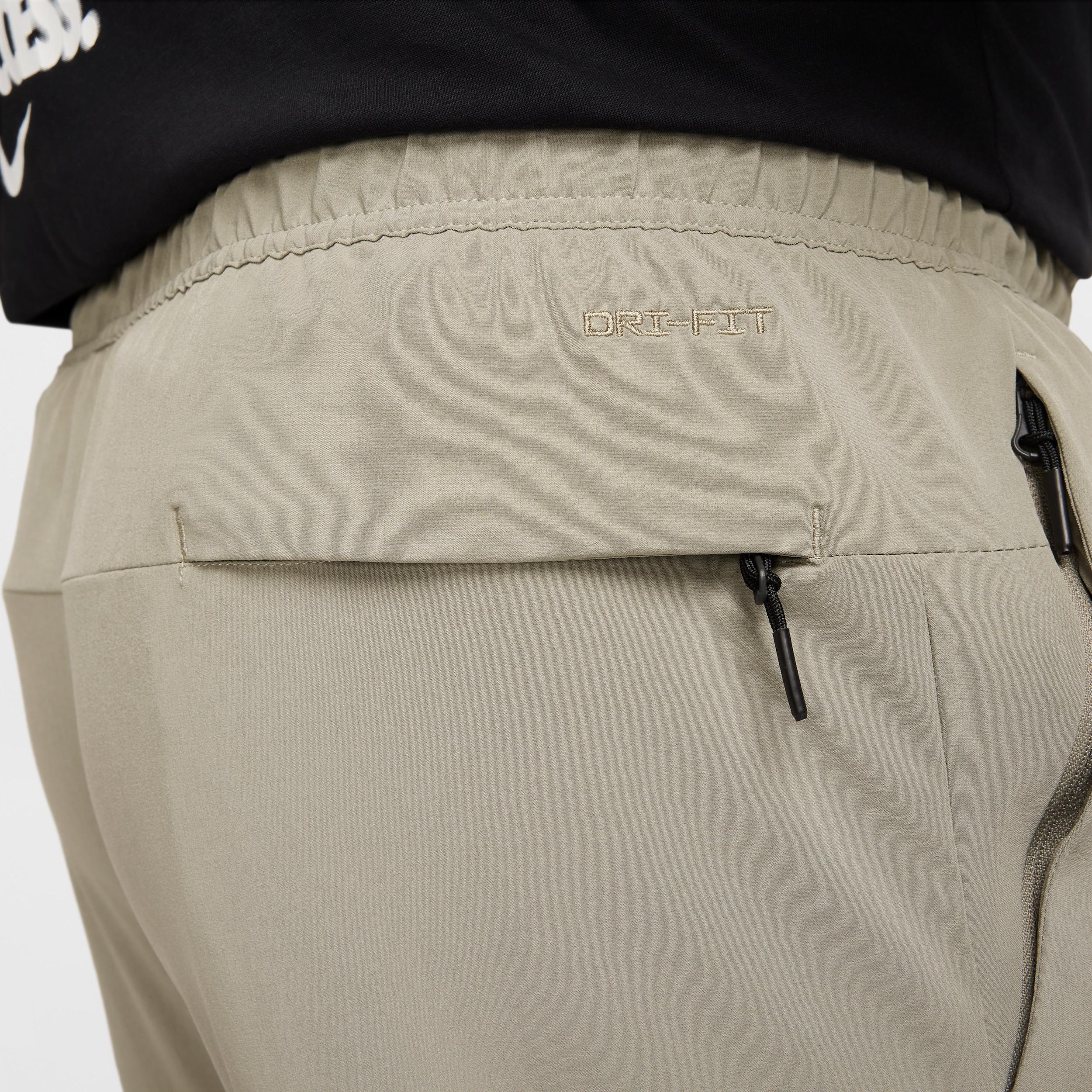 Nike Mens Unlimited Dri-FIT Zippered Cuff Versatile Pants | FB7548-320 Product Image