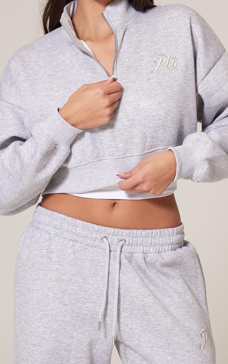 PRETTYLITTLETHING Grey Marl Tonal Embroidered Cropped Half Zip Sweatshirt Product Image