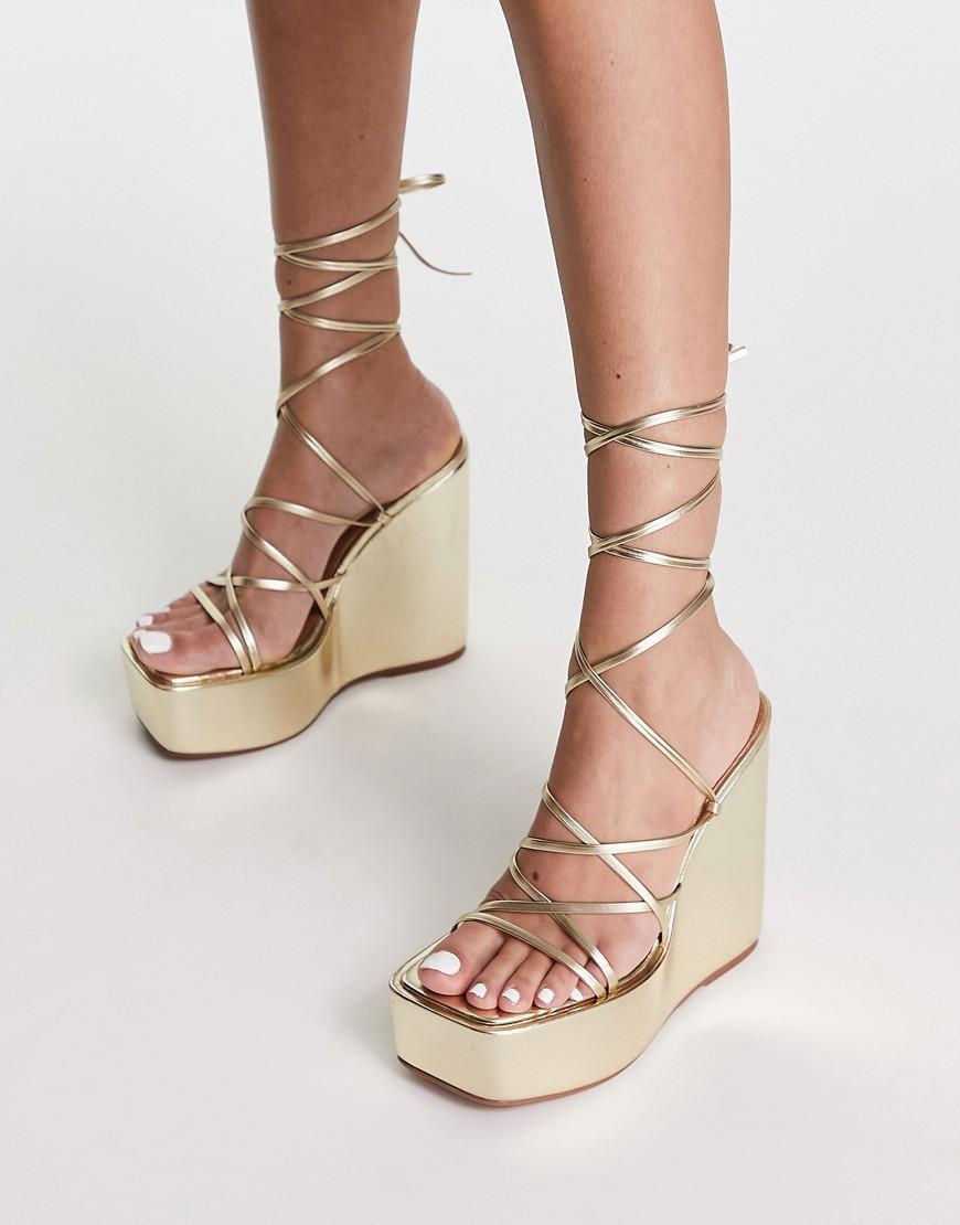 ASOS DESIGN Tanon tie leg wedges in gold Product Image