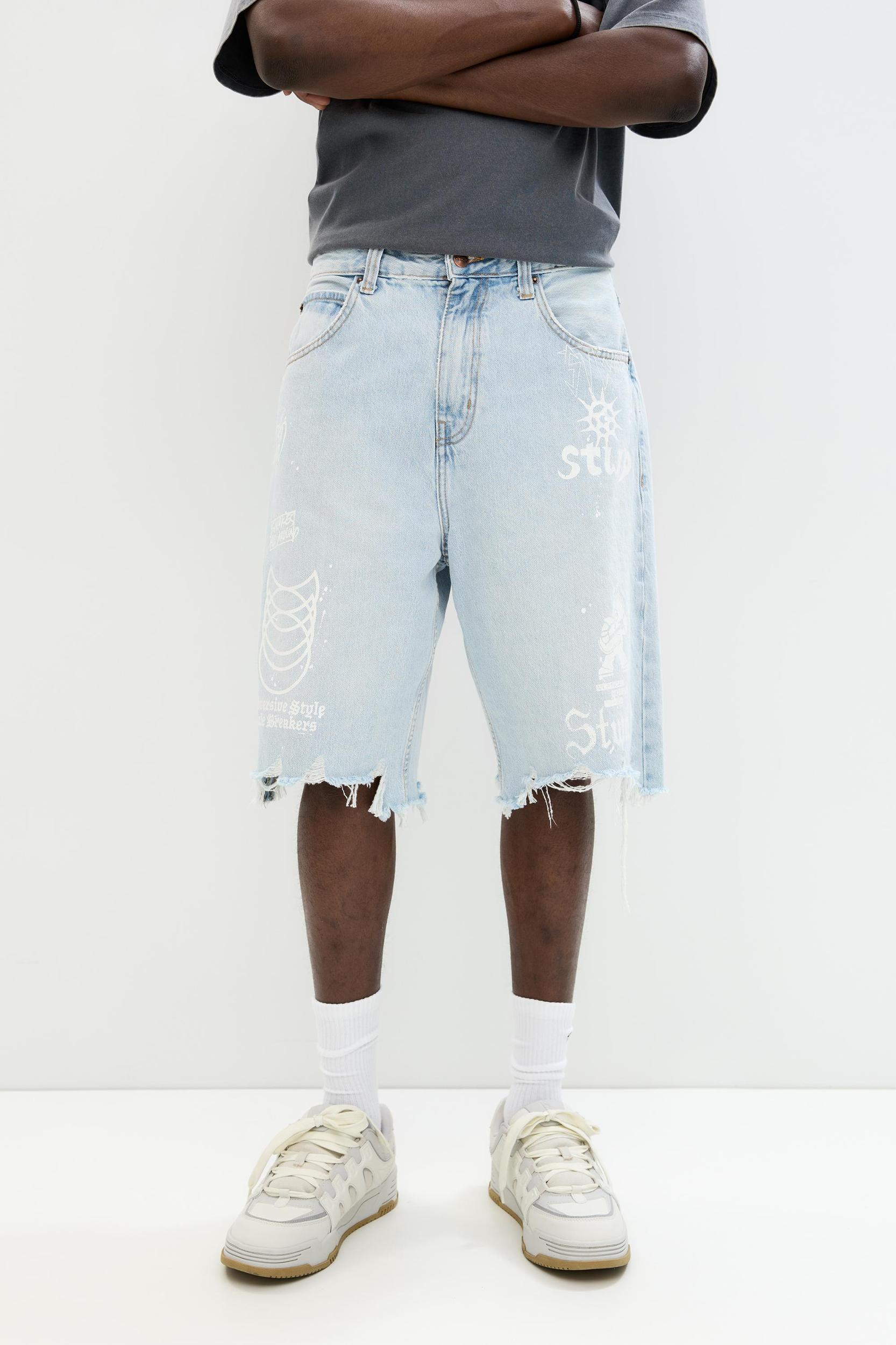 Ripped denim Bermuda shorts Product Image