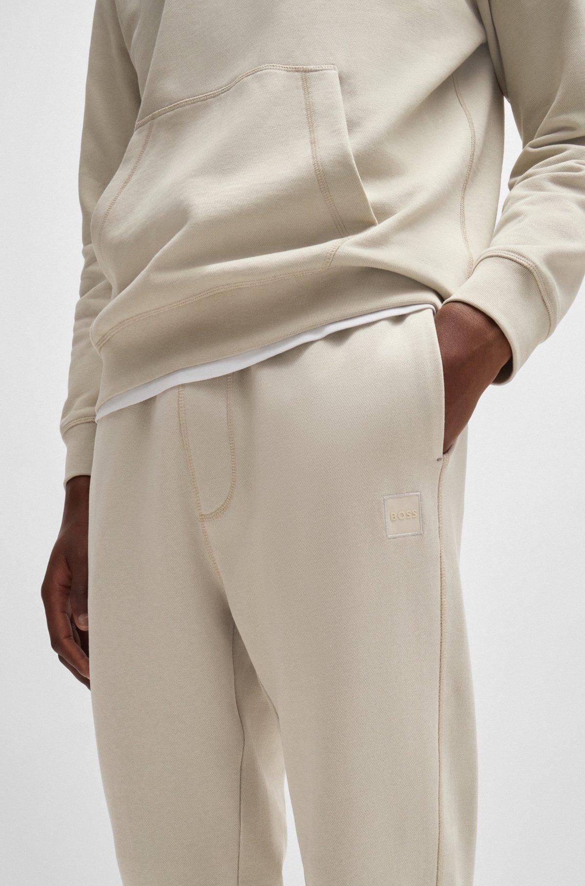Cotton-terry tracksuit bottoms with logo patch Product Image