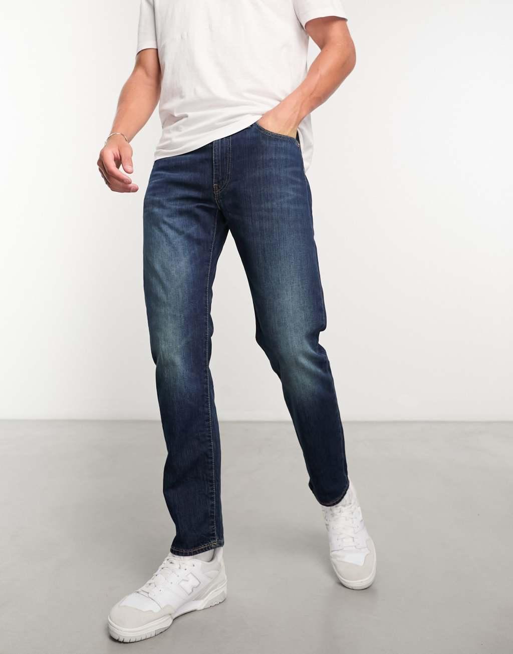 Levi's 502 tapered fit jeans in dark navy wash Product Image