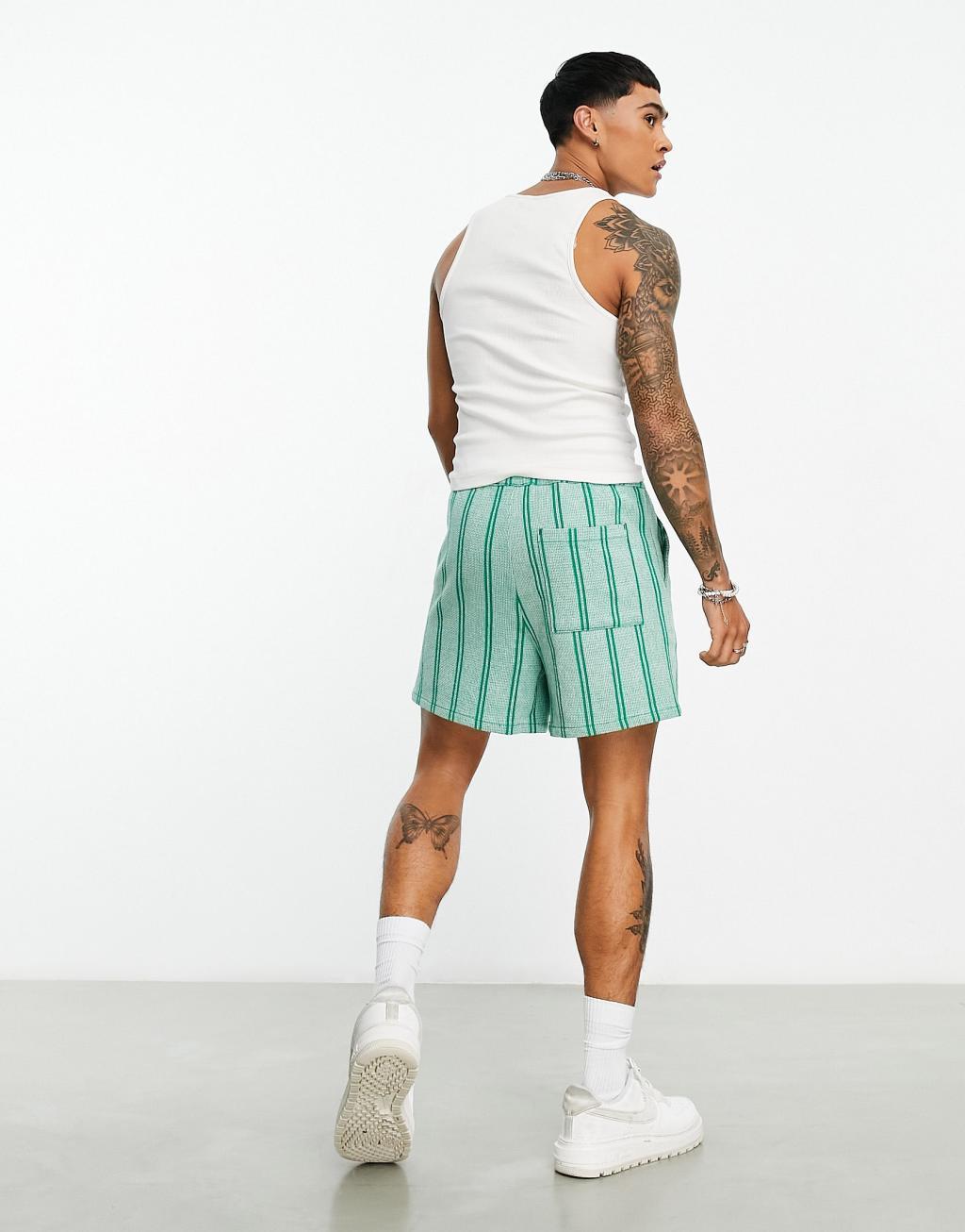 ASOS DESIGN wide cargo shorts with crinkle texture in turquoise Product Image