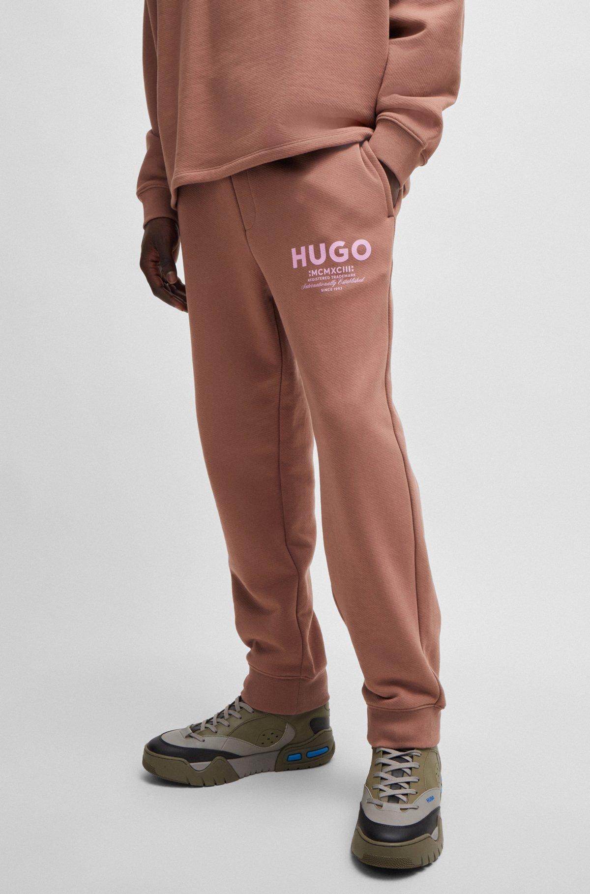 Cotton-terry tracksuit bottoms with logo print Product Image